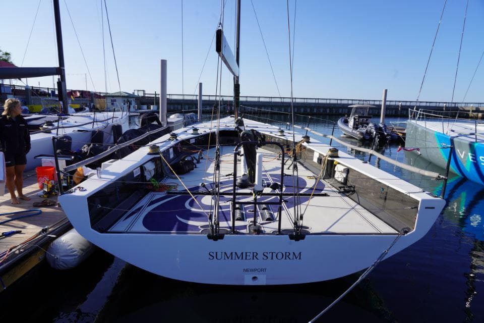 Sleek 2015 Judel and Vrolijk TP 52 yacht "Summer Storm" docked at a marina.