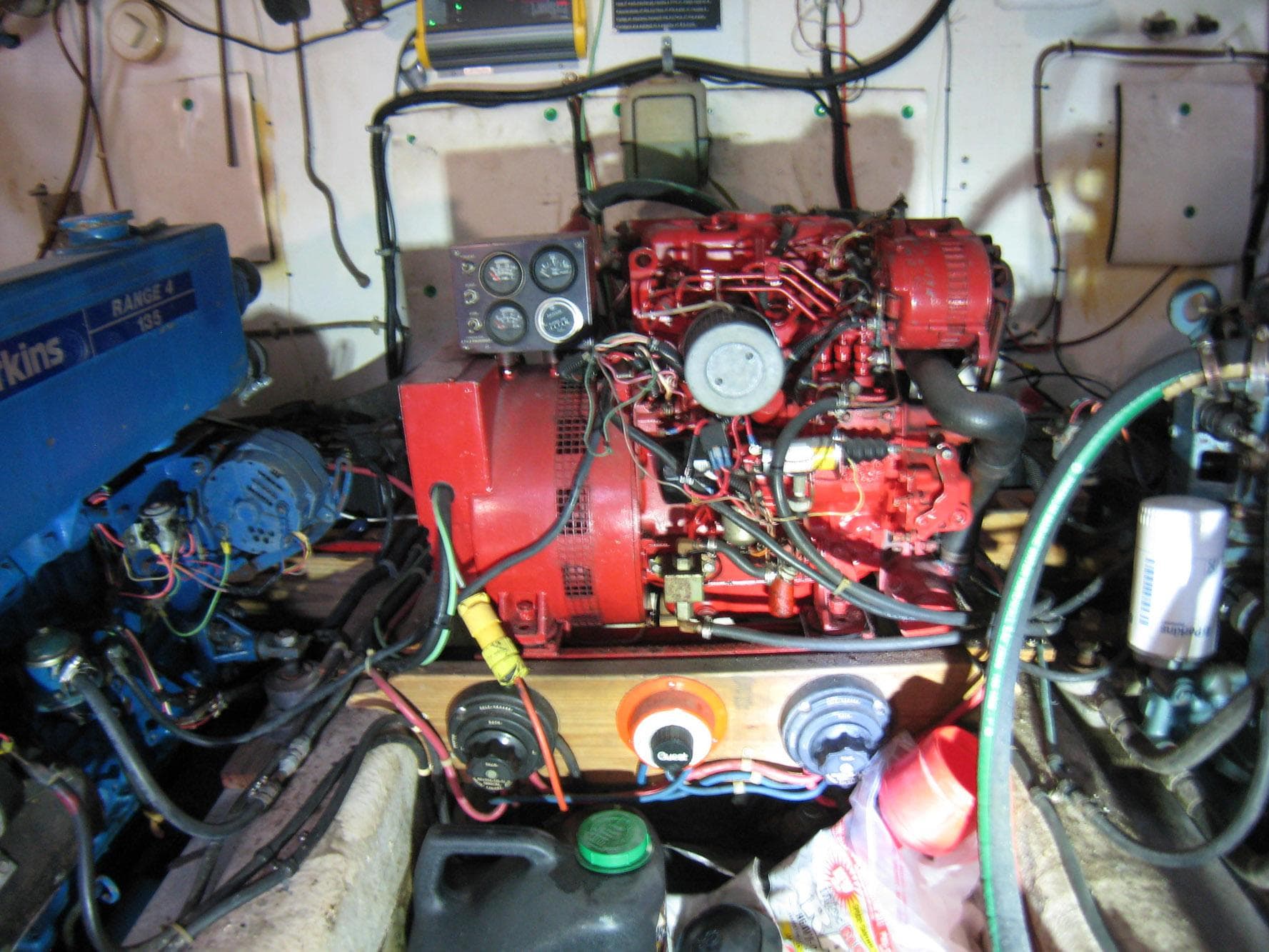 Engine room of a 1987 Custom Pilgrim Tribute boat with visible wiring and components.