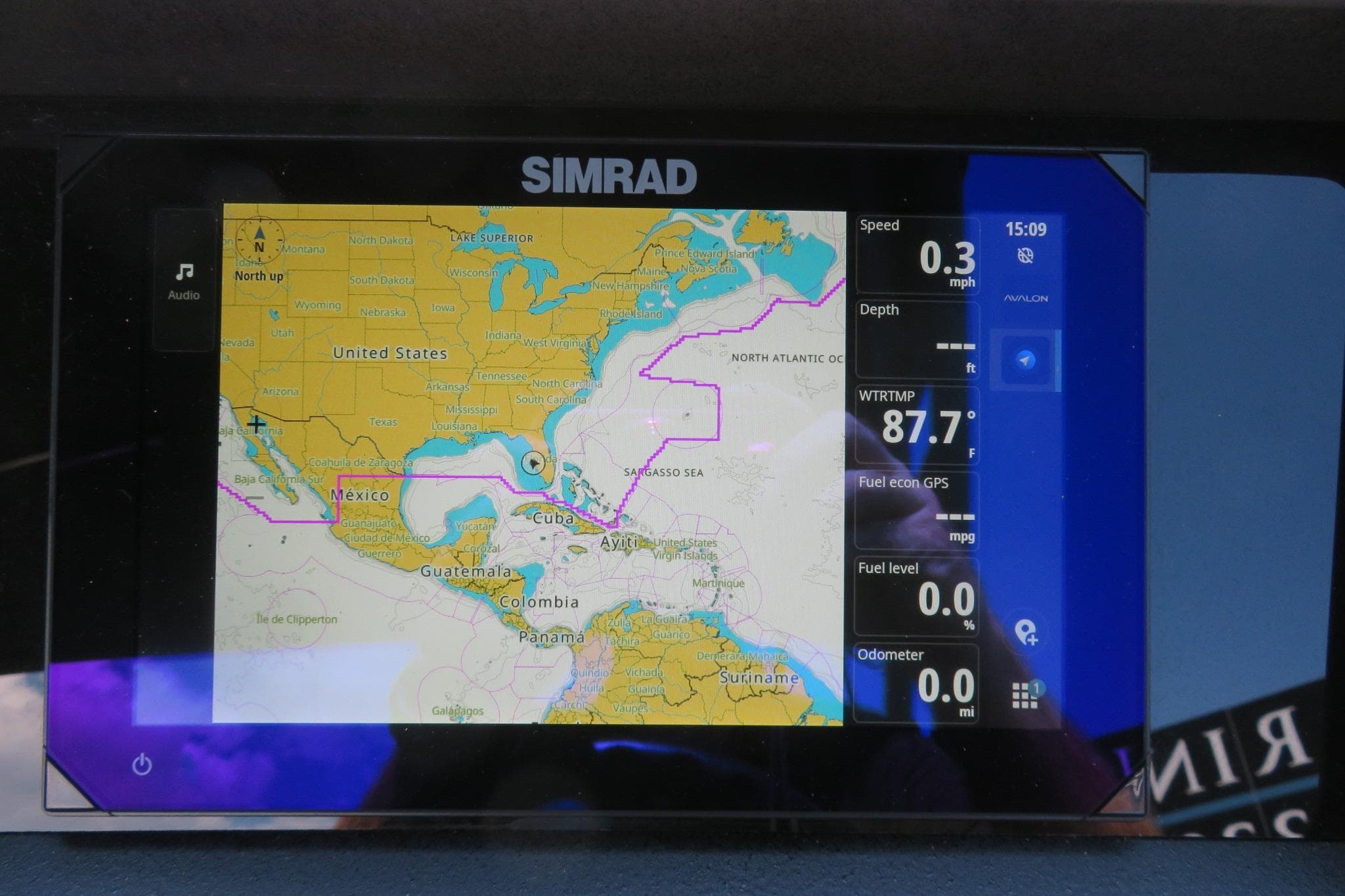 Simrad navigation display on Avalon Catalina Quad Lounge Shift, showing map and data.