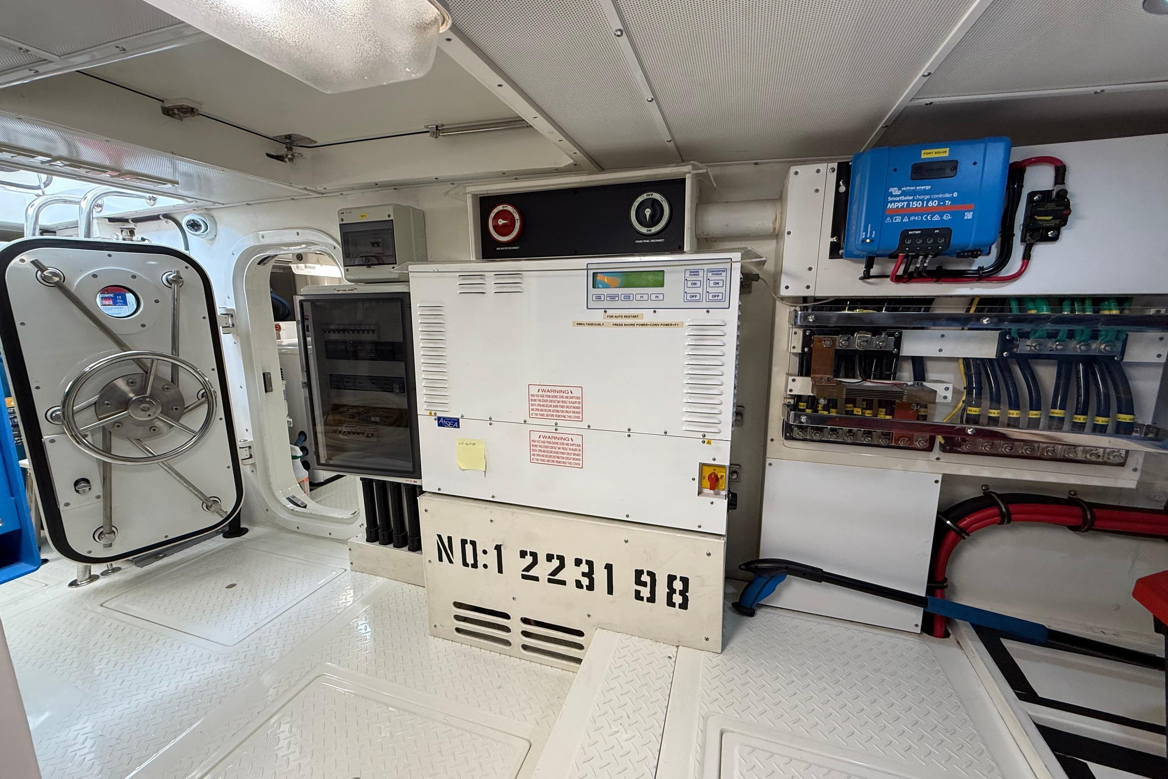 Engine room of 2009 Nordhavn N64 yacht with control panels and equipment.