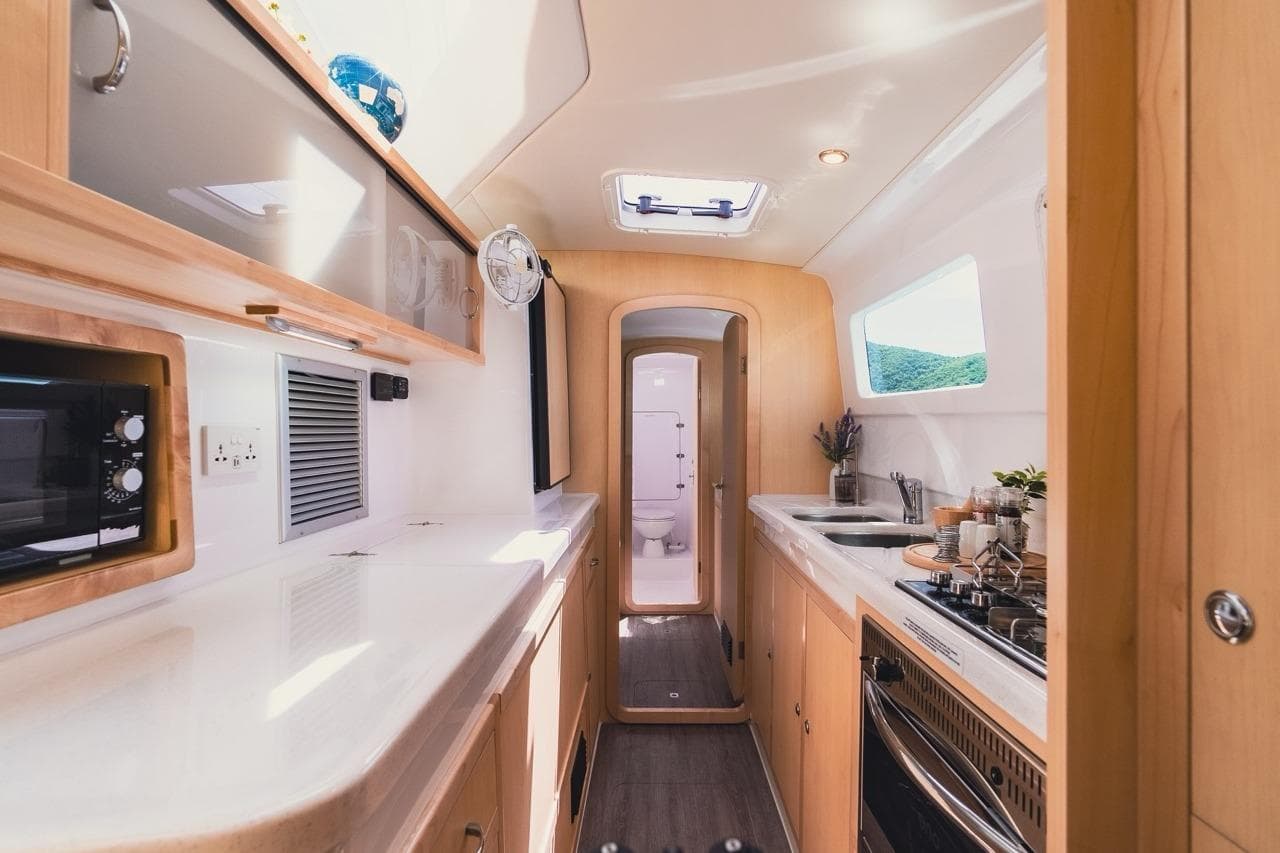 Interior of 2026 Seawind 1160XL yacht, featuring modern kitchen and sleek design.