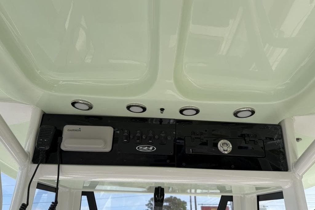 2026 Sea Hunt Ultra 245 SE boat console with Garmin device and lighting.