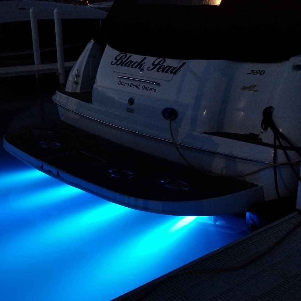 1999 Sea Ray 380 Sundancer with blue underwater lights at night, docked in Grand Bend, Ontario.