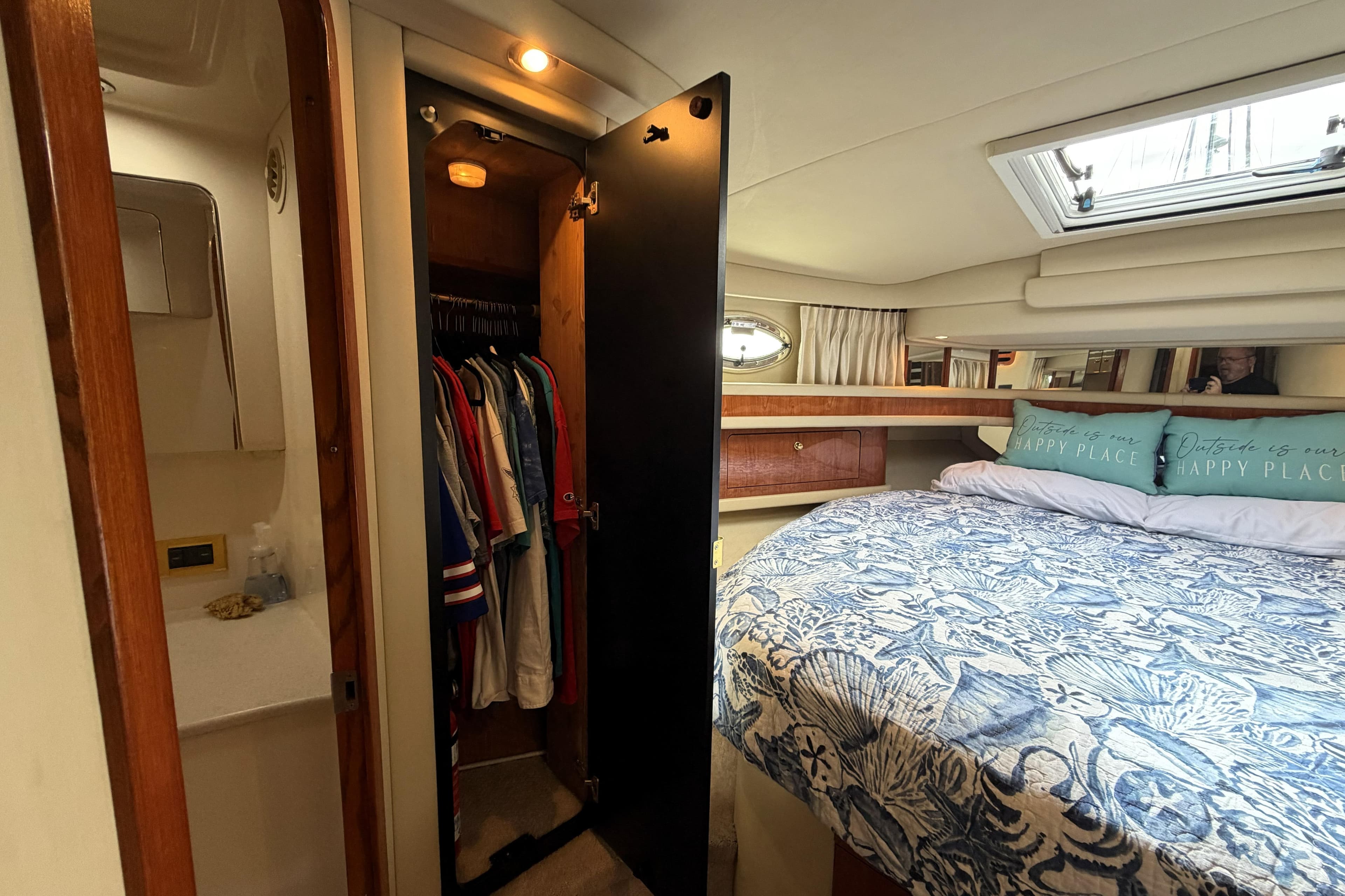 Interior of 2000 Sea Ray 450 Express Bridge with cozy bedroom and closet space.