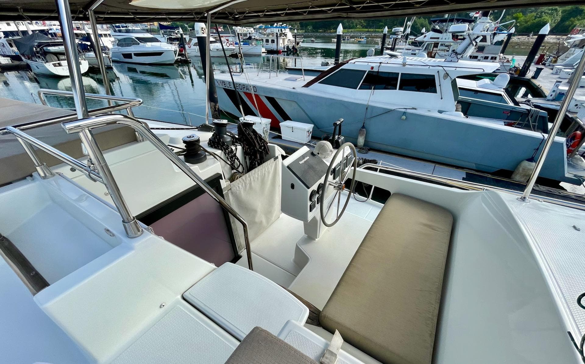 Helm of 2017 Fountaine Pajot SABA 50 catamaran docked at marina.