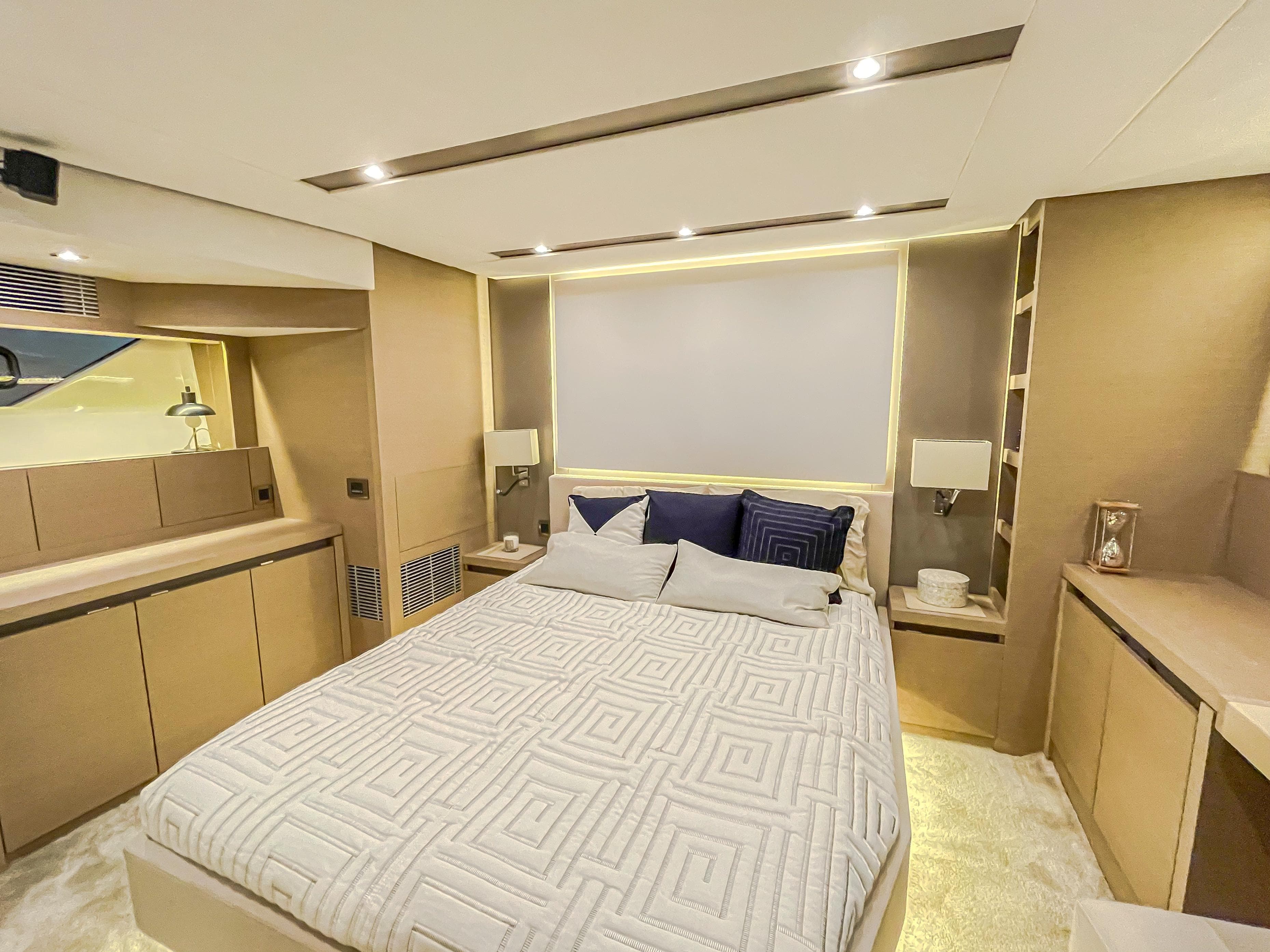 Luxurious bedroom interior of 2016 Prestige 680 Flybridge yacht with modern design.
