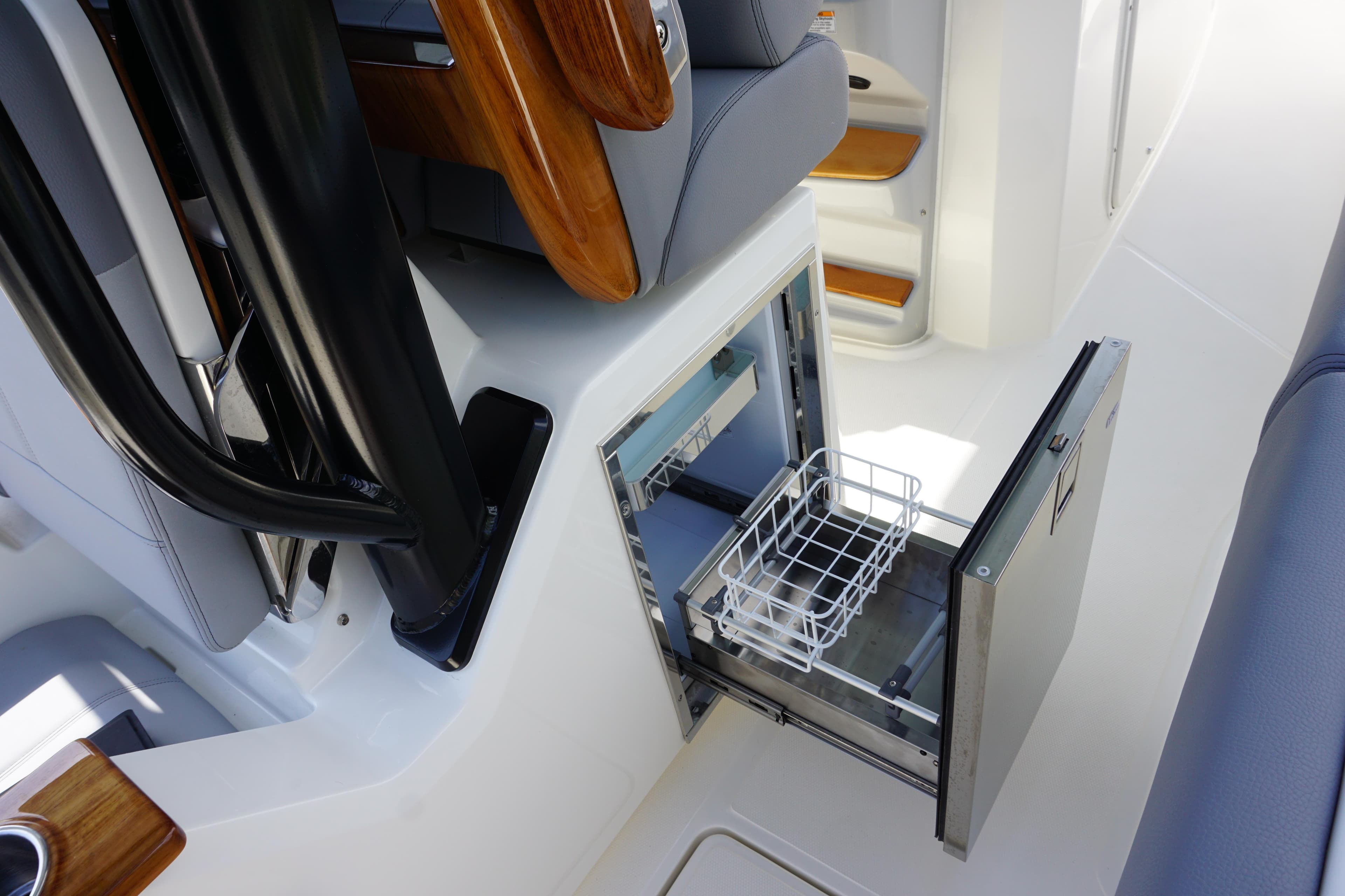 2024 Boston Whaler 360 Outrage boat interior with open storage compartment.