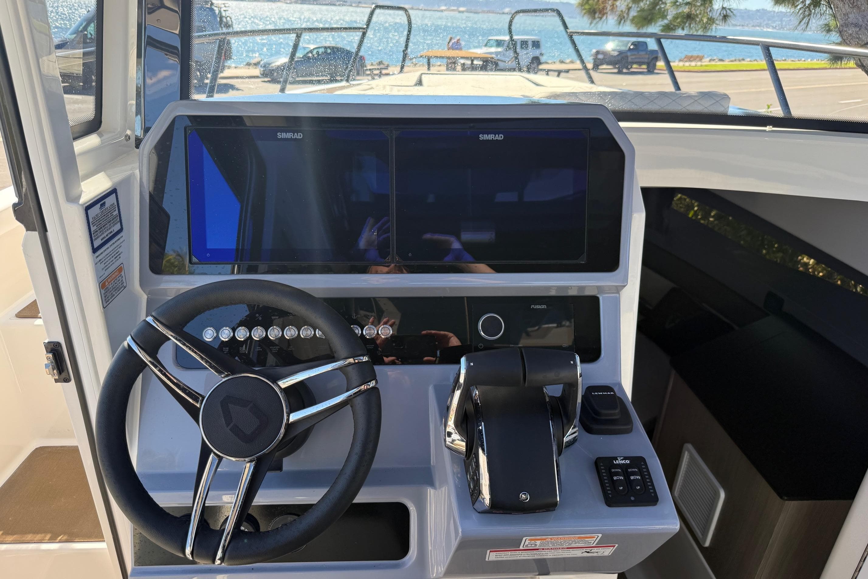 2025 Navan C30 boat dashboard with steering wheel and navigation controls.