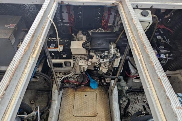 Engine room of a 1998 Silverton 402 Motor Yacht with visible Kohler power system.