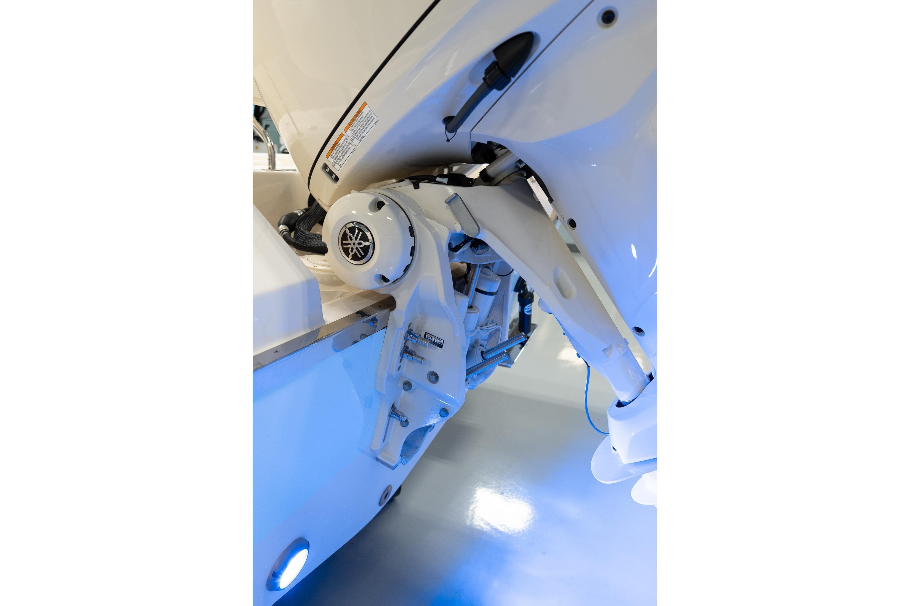 2025 Grady-White 251 Coastal Explorer boat engine detail with blue lighting.