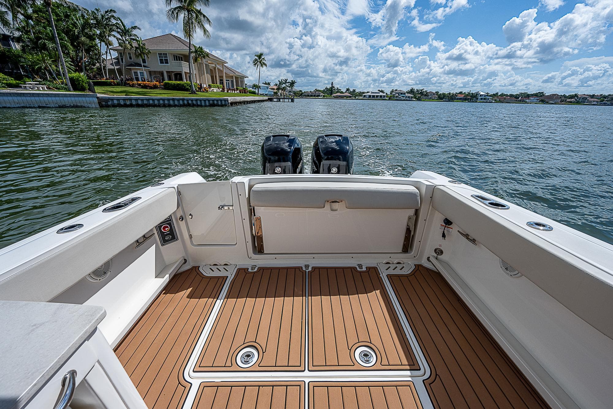 2018 Boston Whaler 270 Vantage boat interior with dual engines on a sunny day.