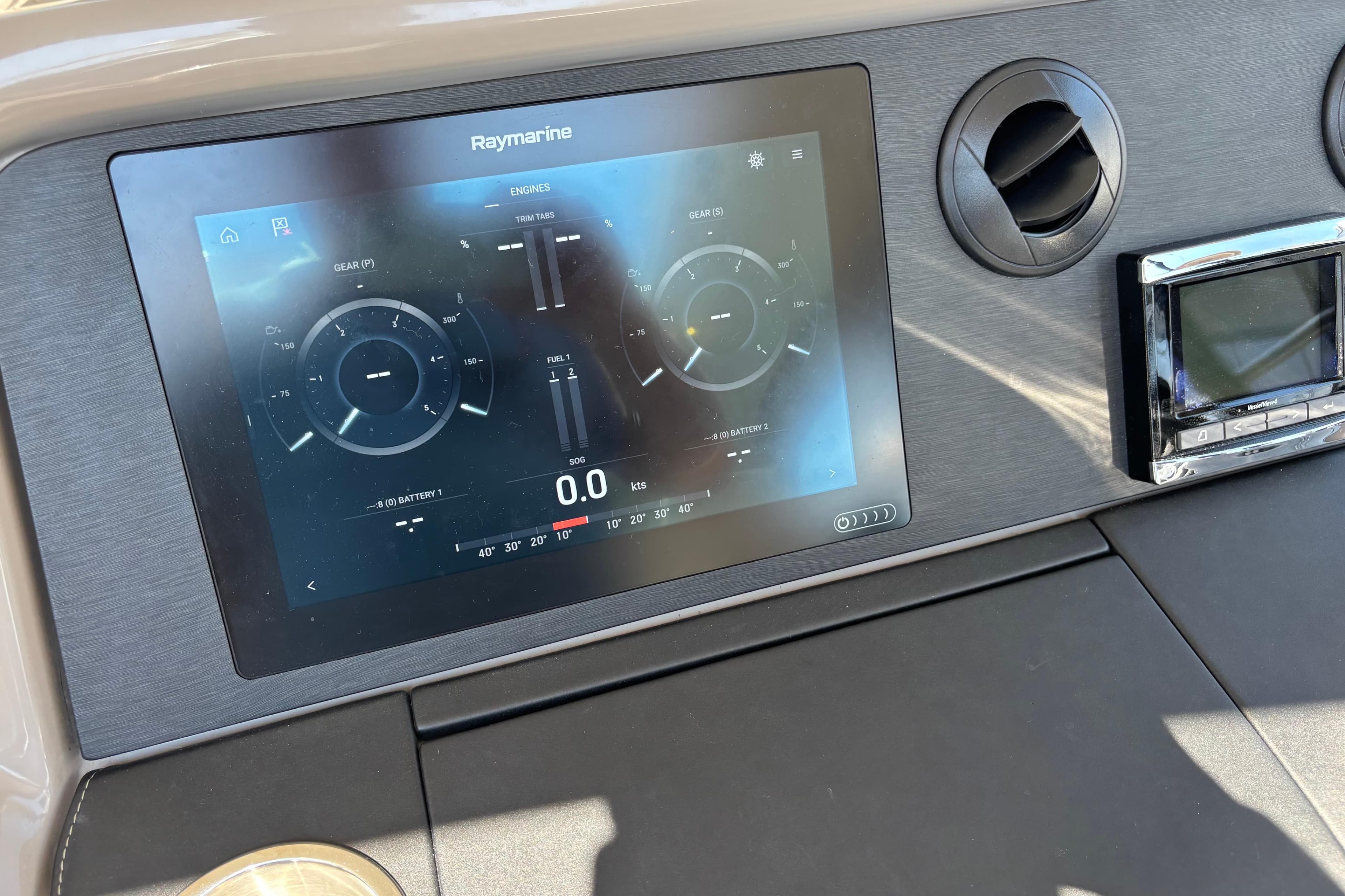 Raymarine display on 2018 Sea Ray Sundancer 460 dashboard, showing engine and navigation data.