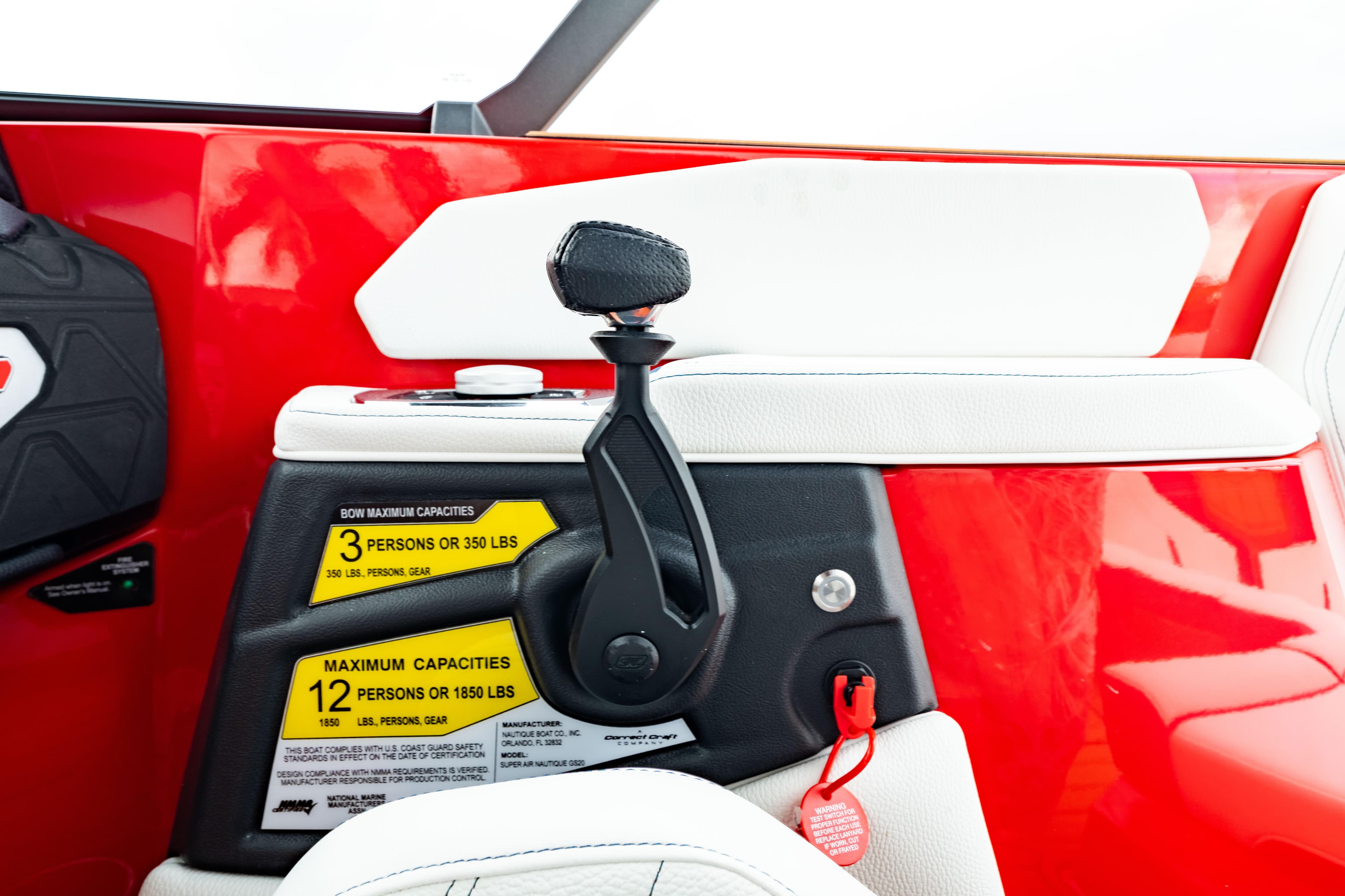 2025 Nautique Super Air Nautique GS20 interior, red and white design, capacity labels visible.