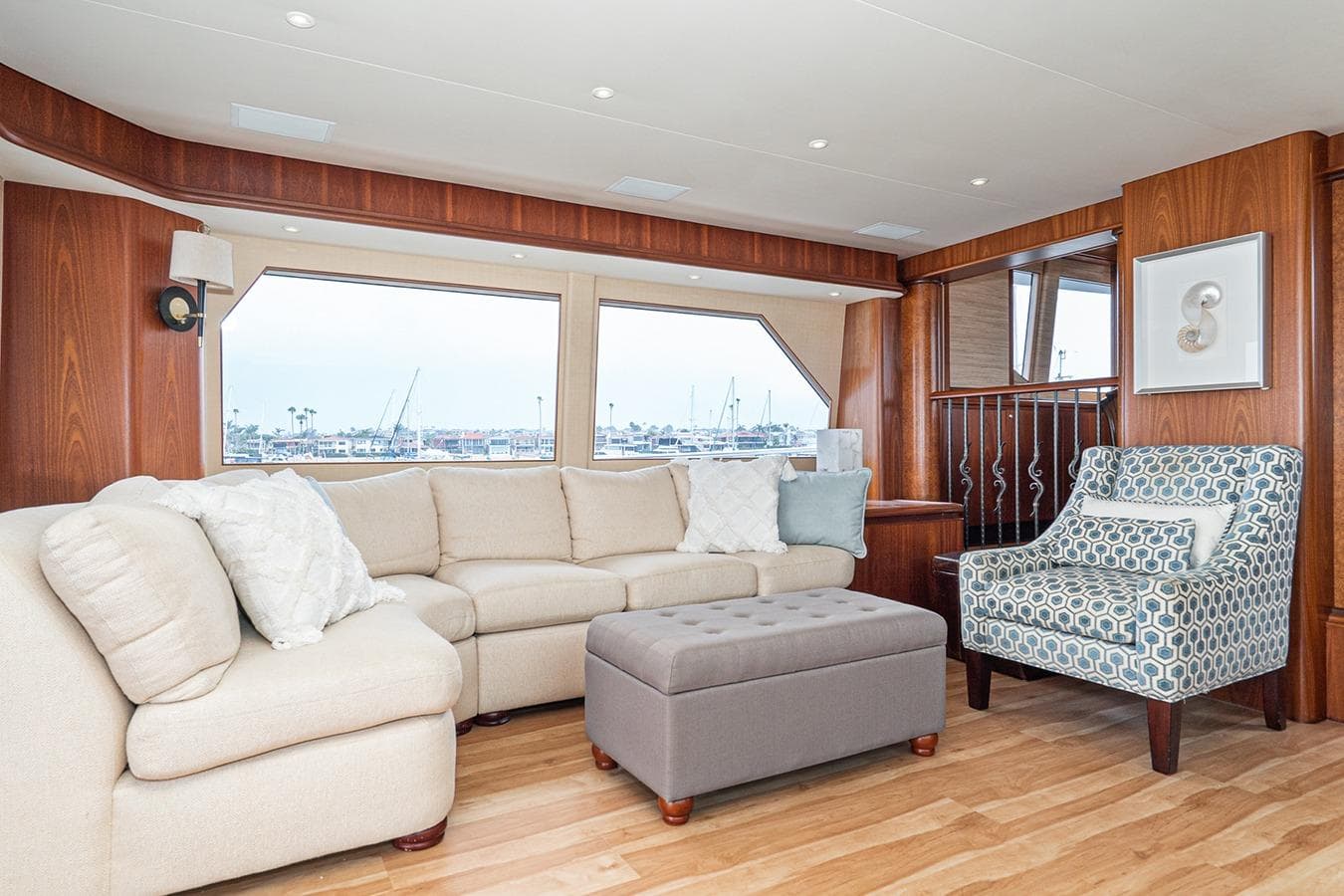 Luxurious 2003 West Bay Sonship yacht interior with elegant seating and scenic window views.