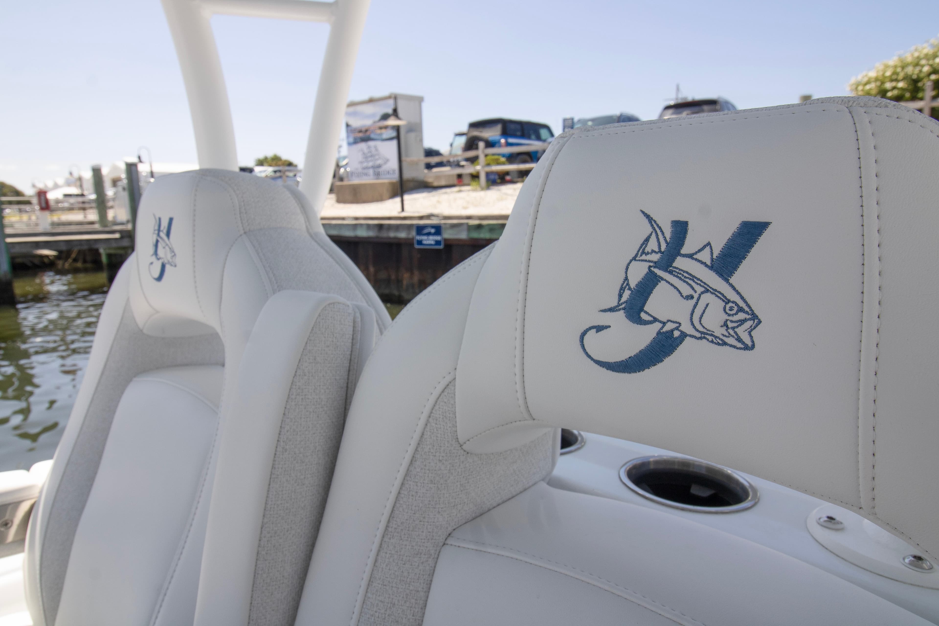 2026 Yellowfin 36 Offshore boat seats with embroidered fish logo at marina.