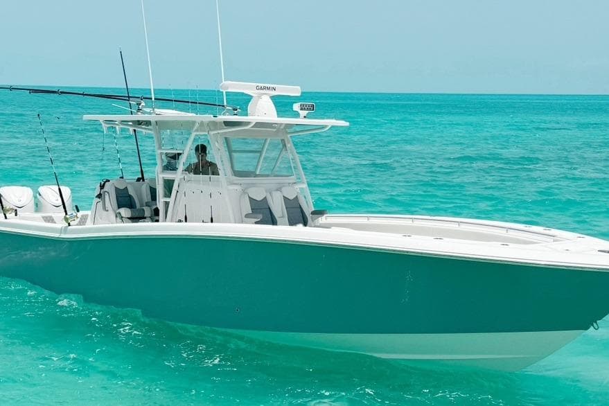 2024 Invincible 39 Open Fisherman boat on turquoise ocean waters.
