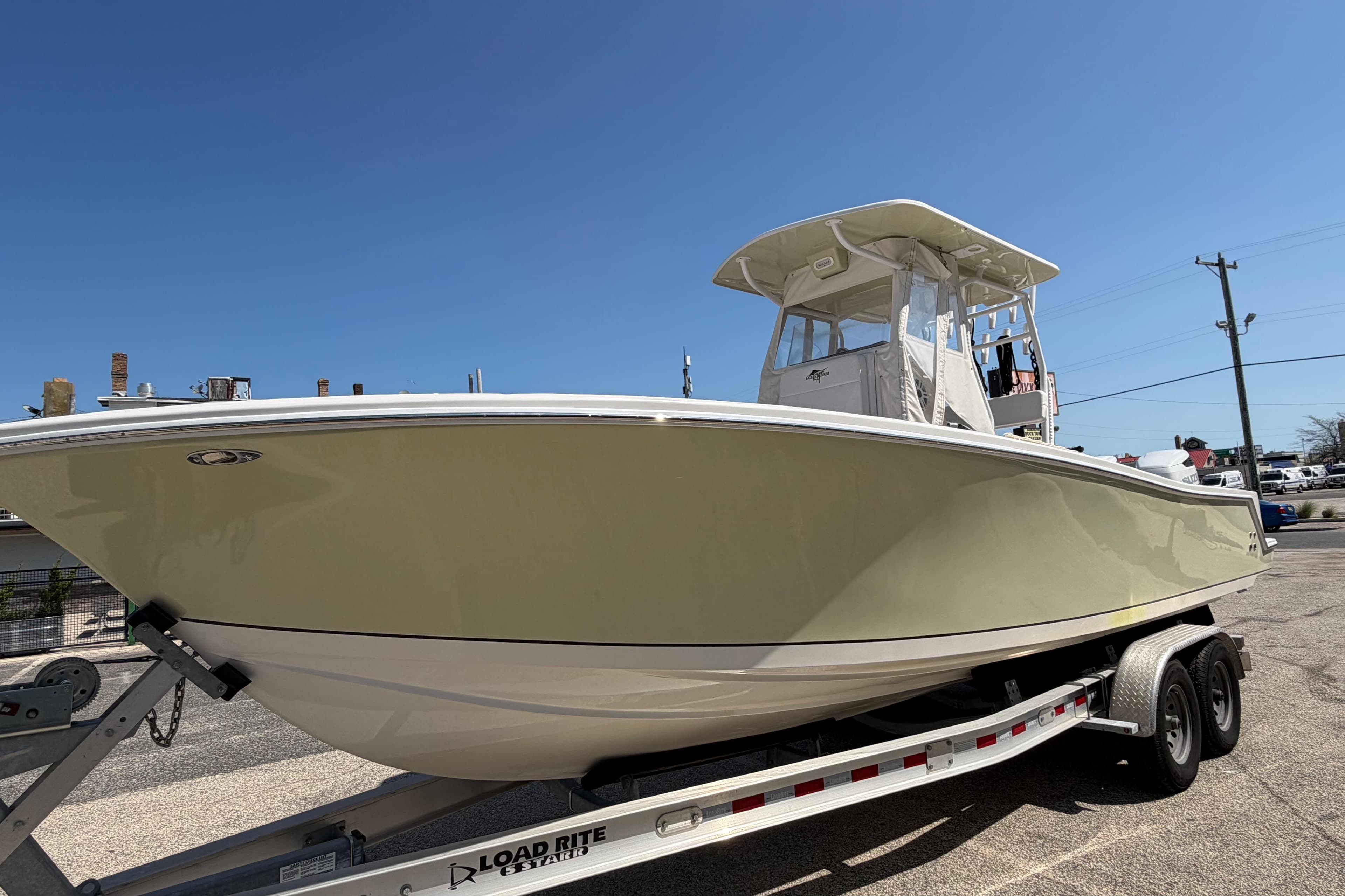 2023 Ocean Runner 2 boat on trailer under clear blue sky.