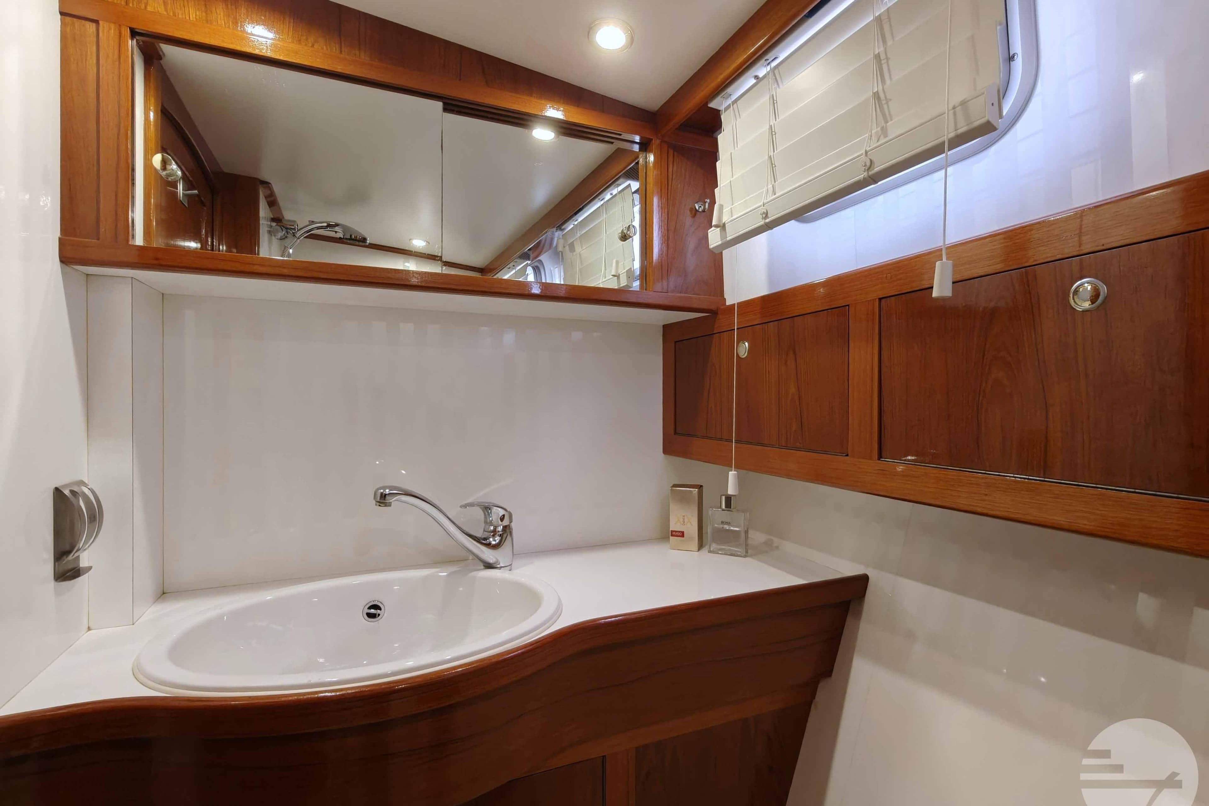 Luxurious bathroom interior of 2001 Pikmeerkruiser 11.50 OK Royal yacht with wooden cabinetry.