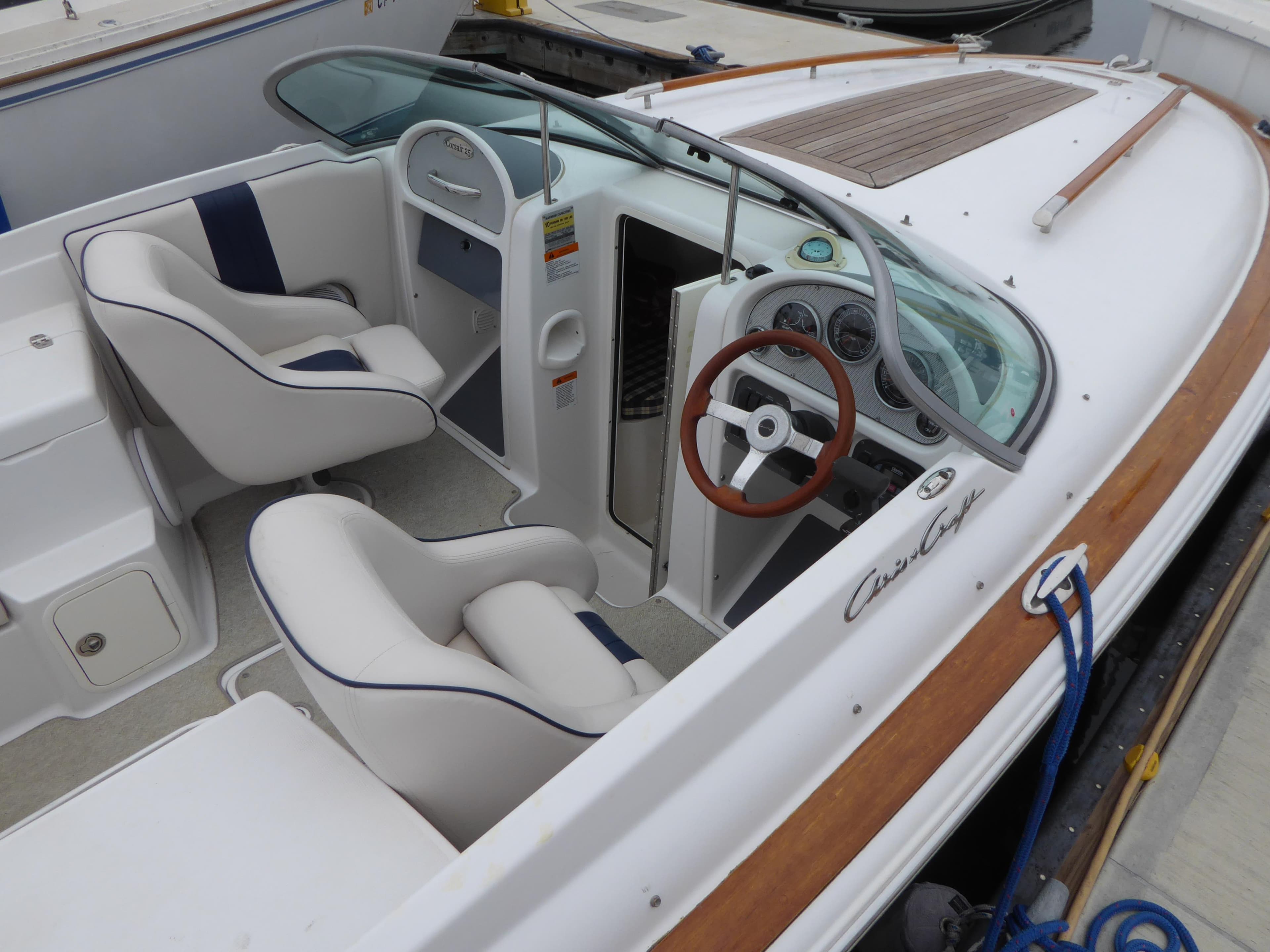 2004 Chris-Craft Corsair 25 boat with luxurious interior and wood accents.