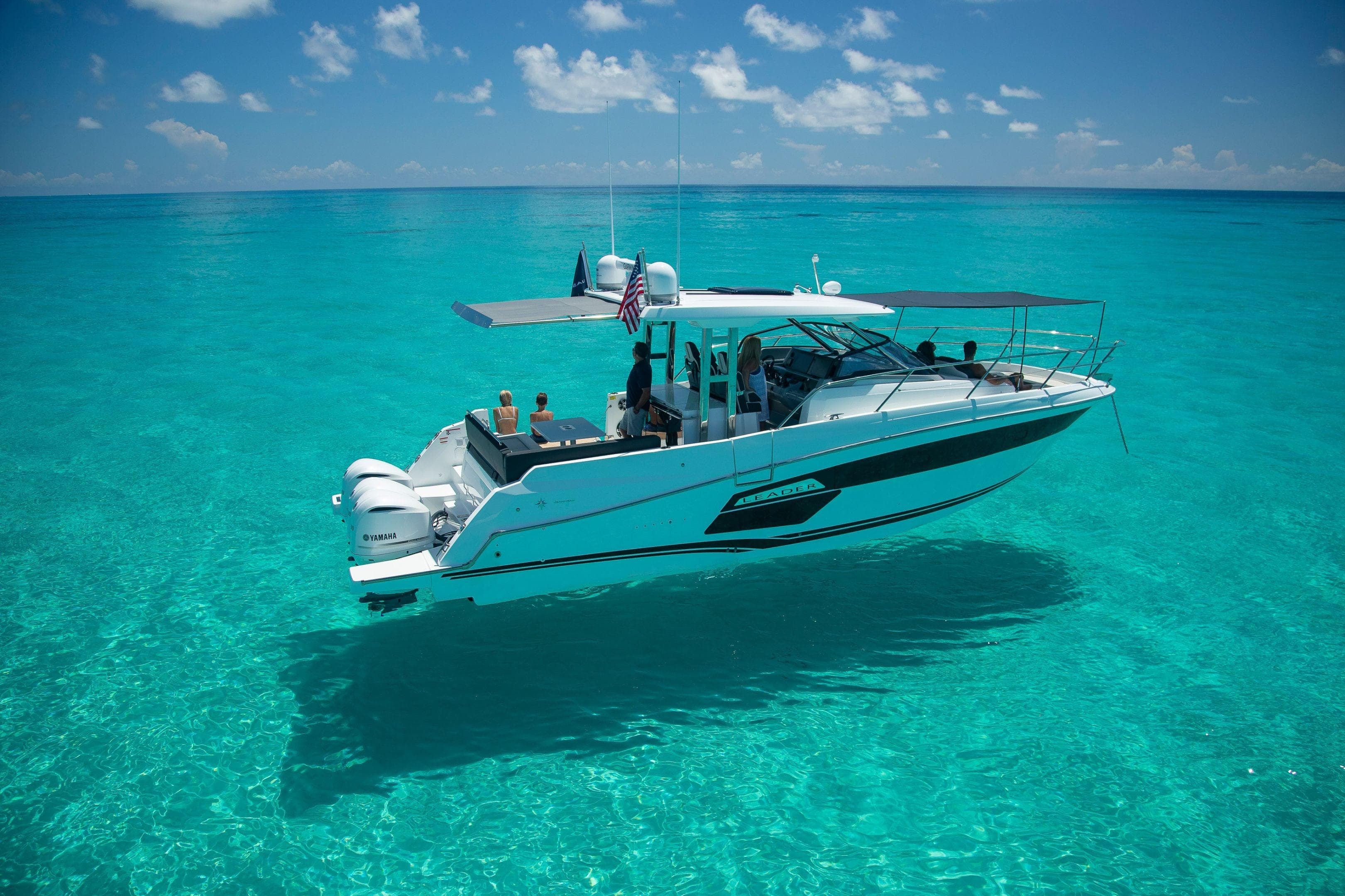 2026 Jeanneau Leader 12.5 WA cruising on clear turquoise waters under a sunny sky.