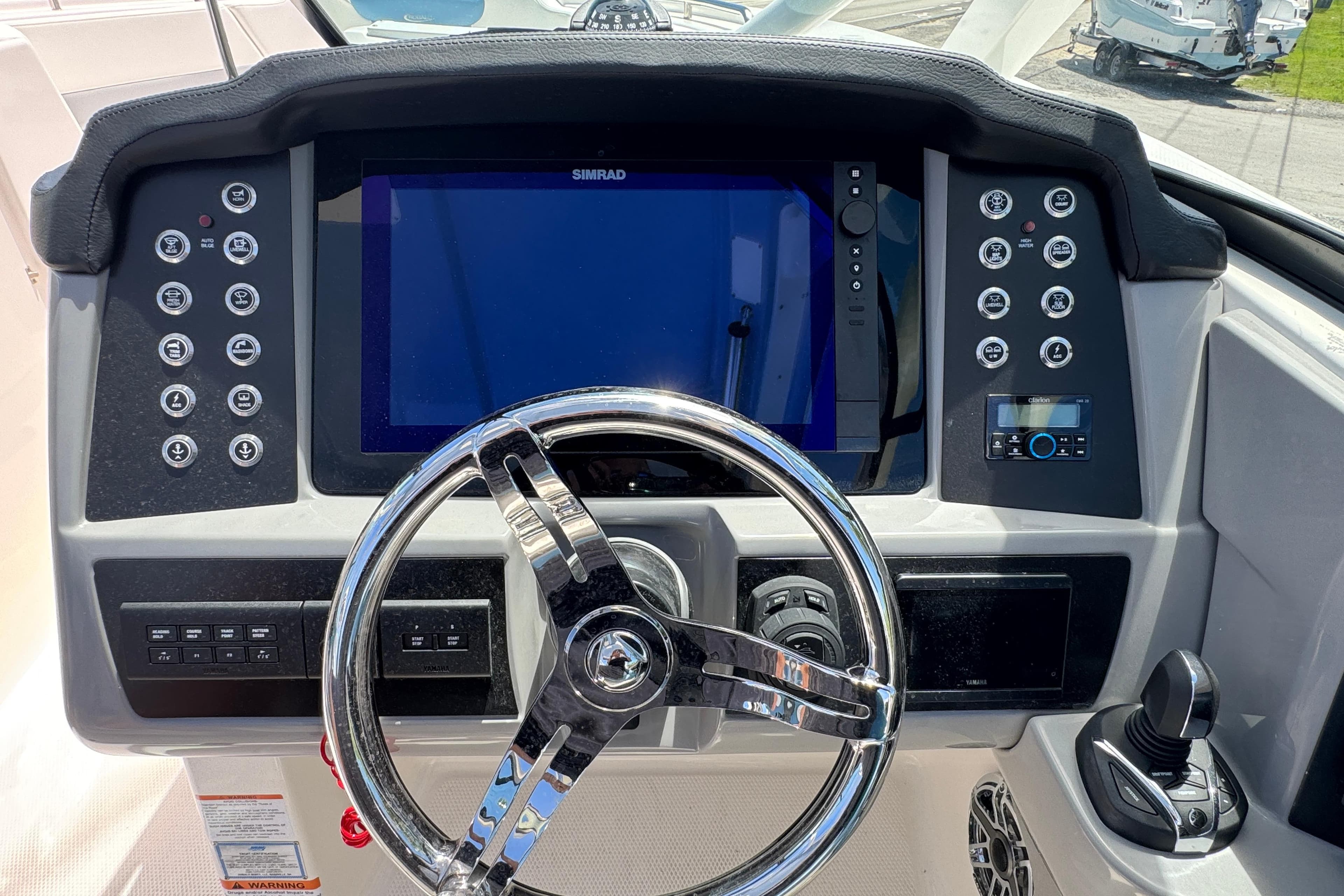 2026 Robalo R317 Dual Console dashboard with steering wheel and control panel.