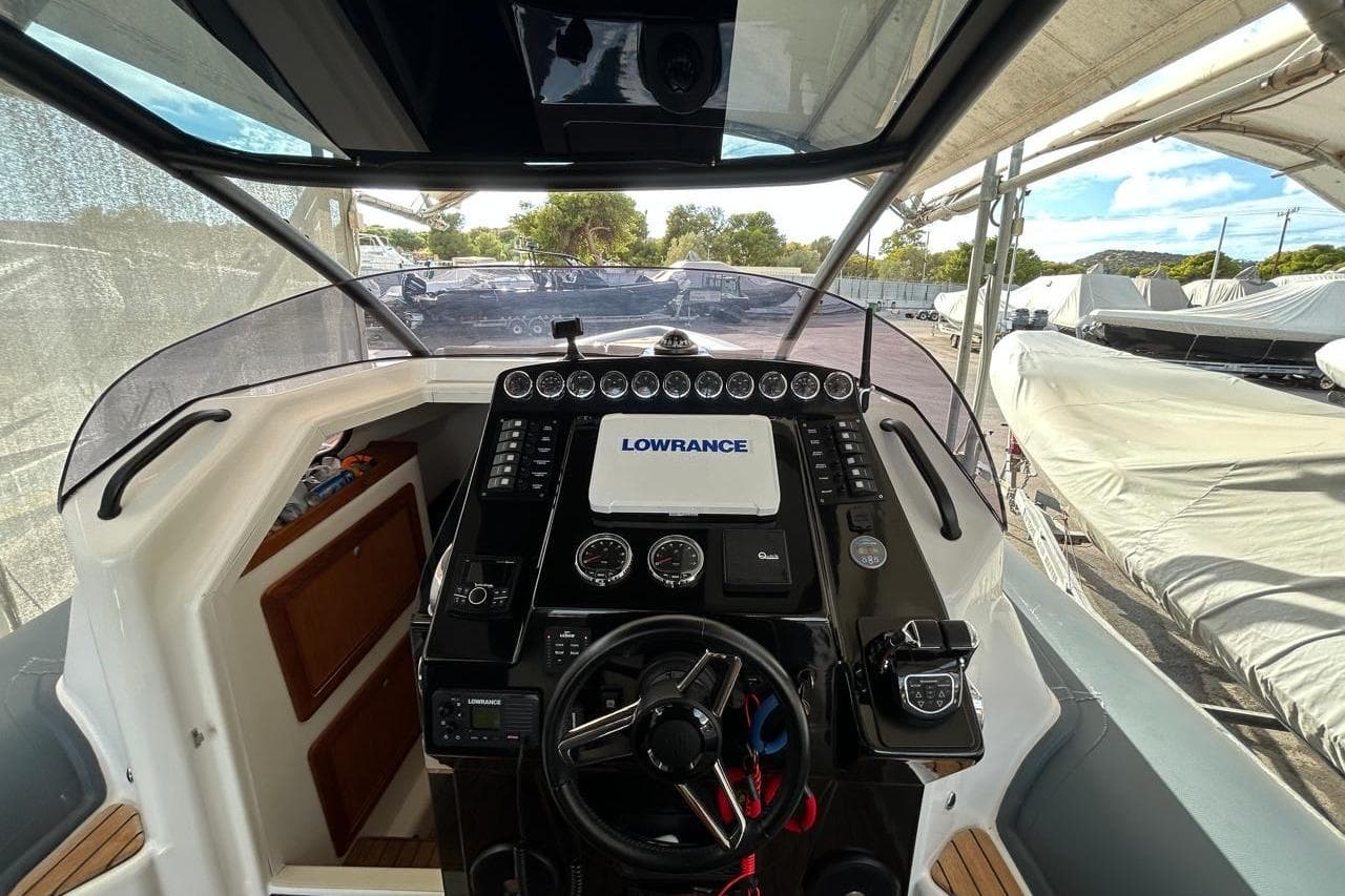 Cockpit of 2019 Seafighter 36 boat with navigation equipment and steering wheel.