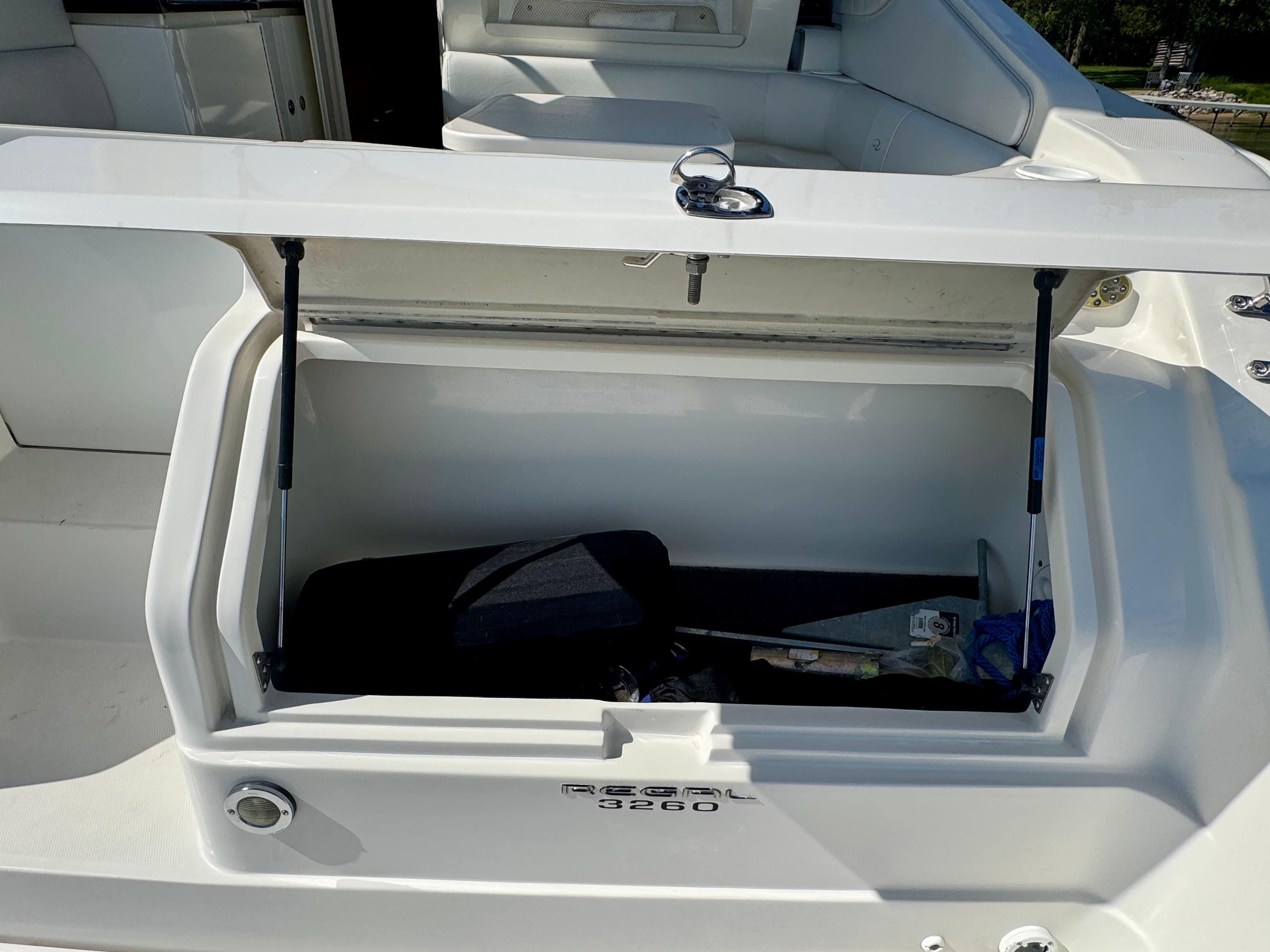 Open storage compartment on Regal Commodore 3260 boat, year 2004.