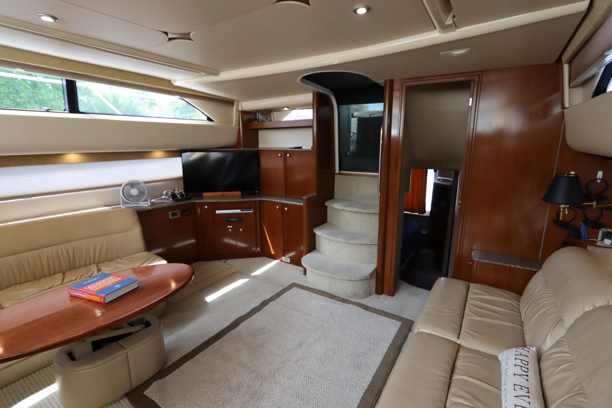 Luxurious interior of a 2005 Meridian 459 Motoryacht with elegant seating and modern amenities.