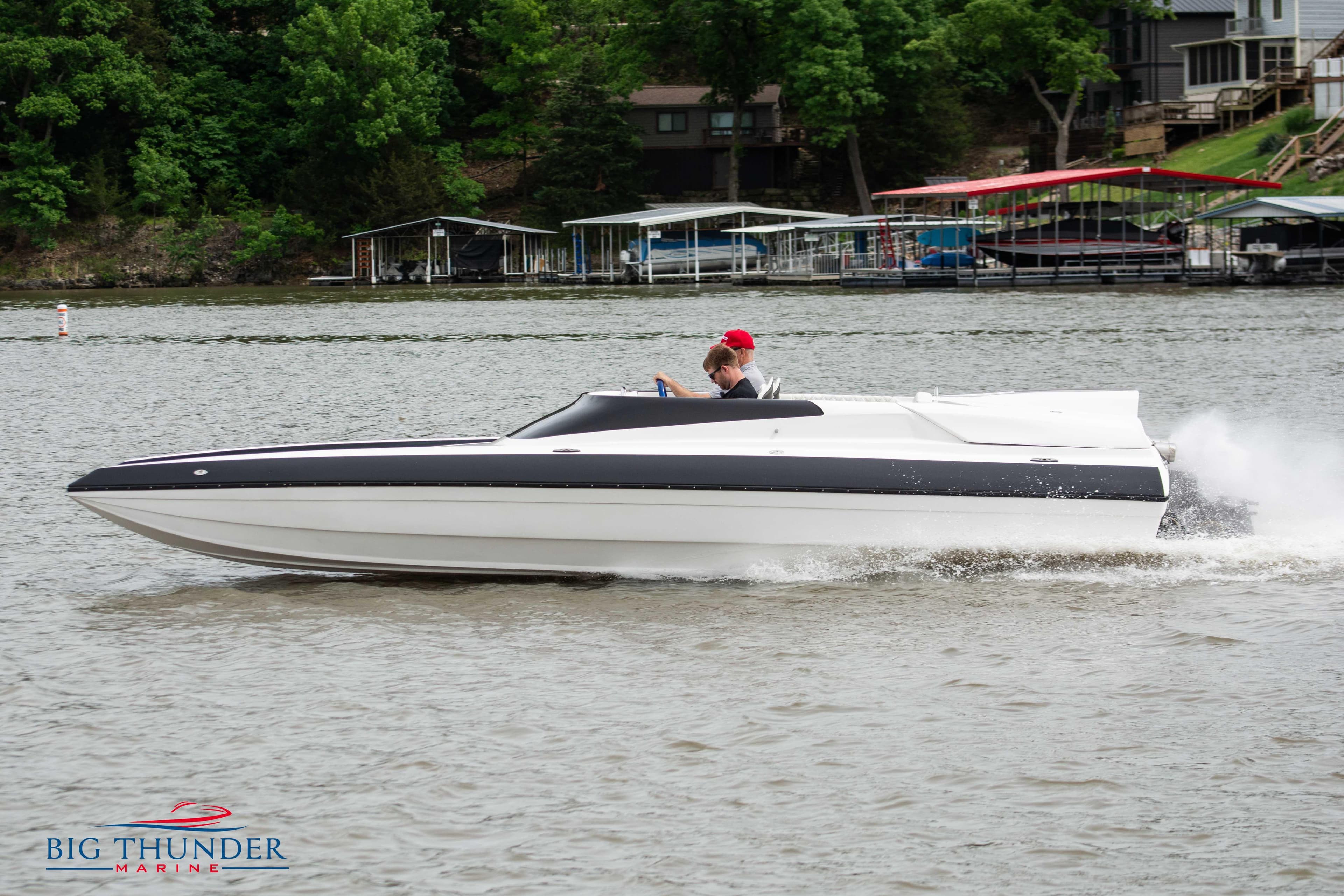 2019 Spectre Screaming Eagle 22 Talon speedboat on a lake.
