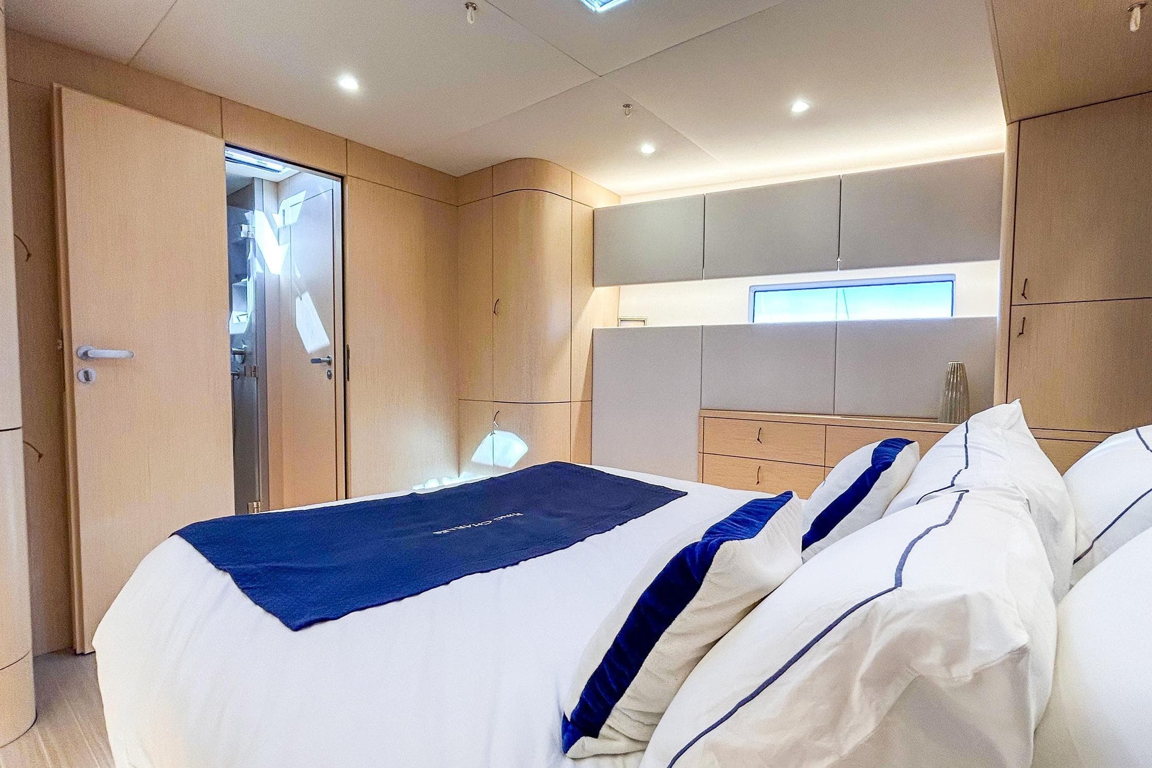 Luxurious 2024 YYachts Y8 cabin interior with modern design and elegant bedding.