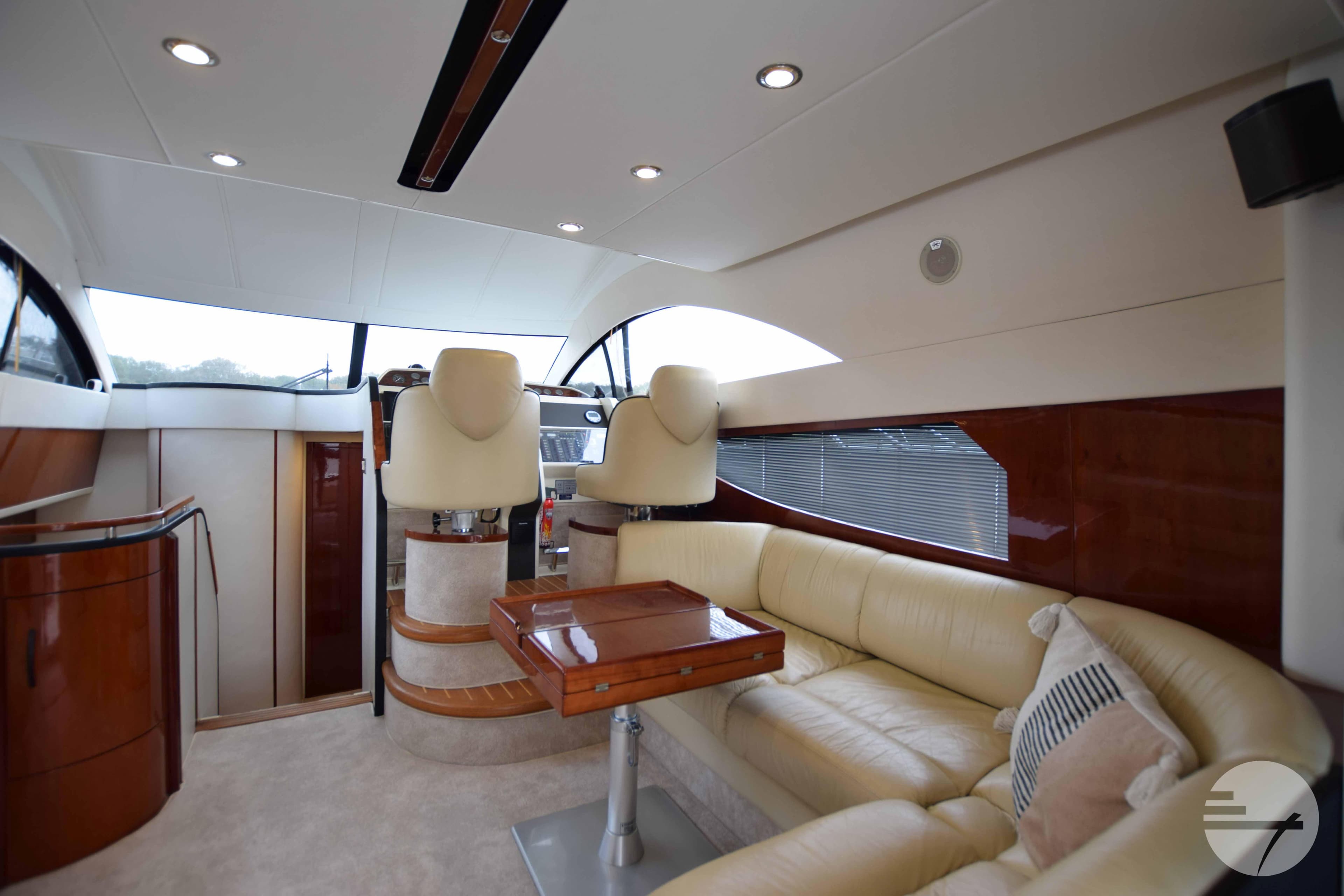 Interior of 2001 Fairline Phantom 43 yacht with elegant leather seating.