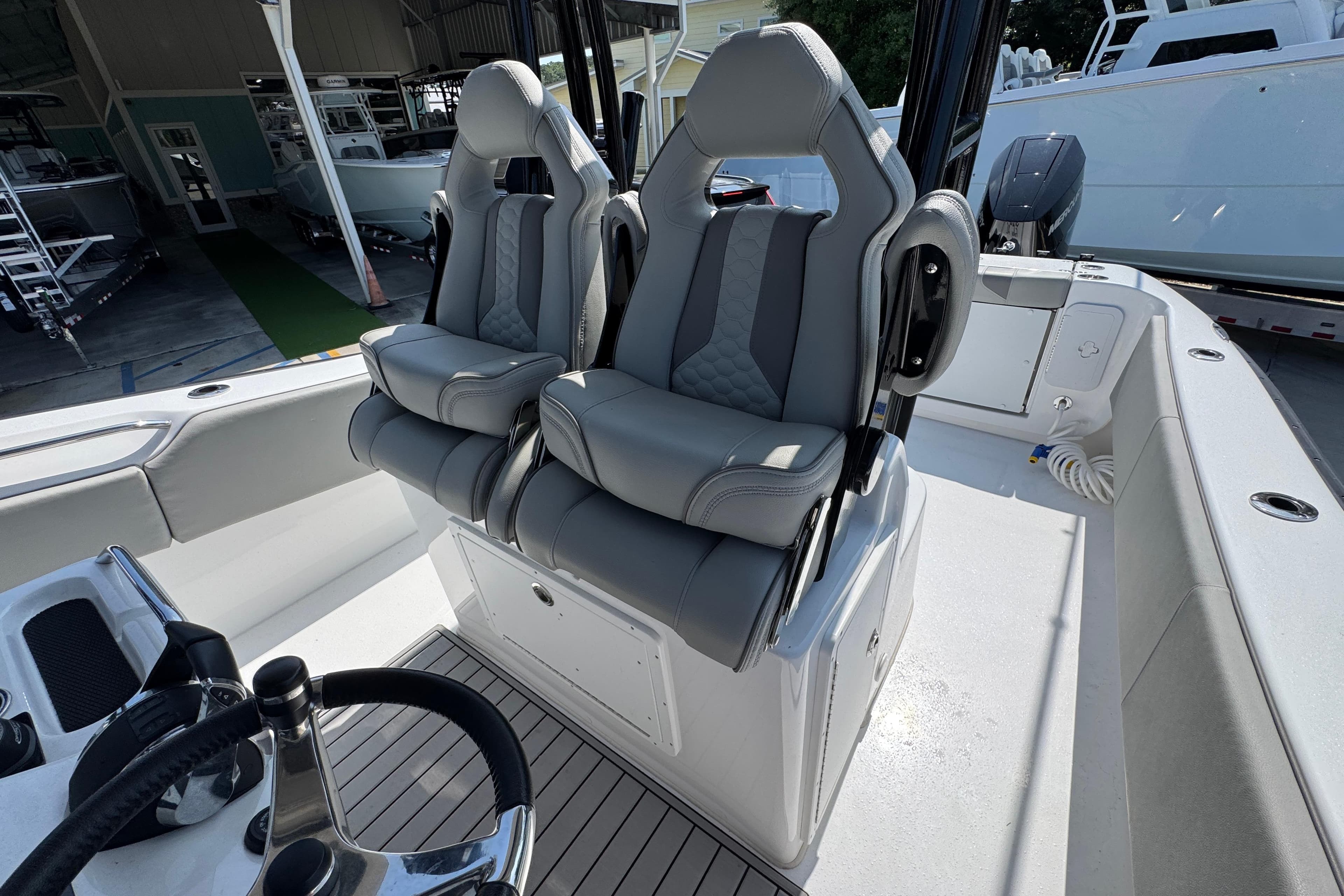 2025 Cape Horn 32 XS boat interior with dual gray captain seats.