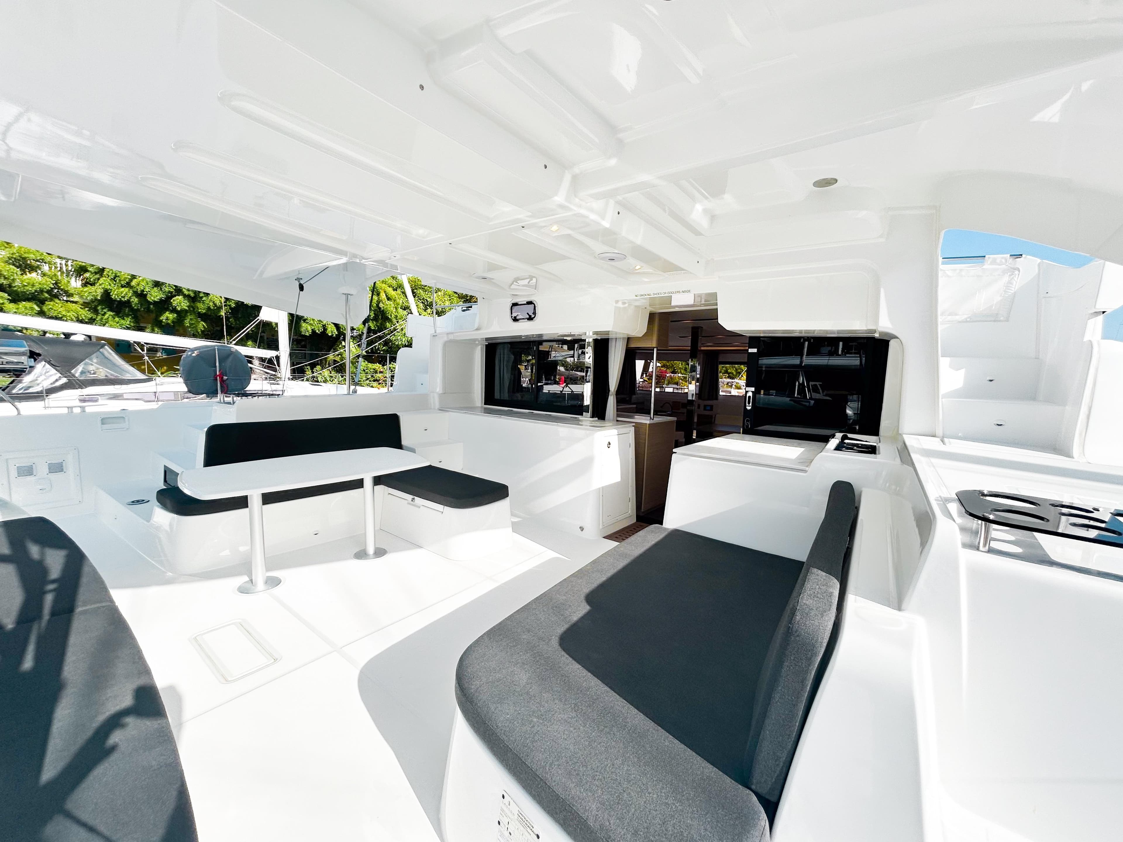 Interior of 2024 Lagoon 46 yacht with modern seating.