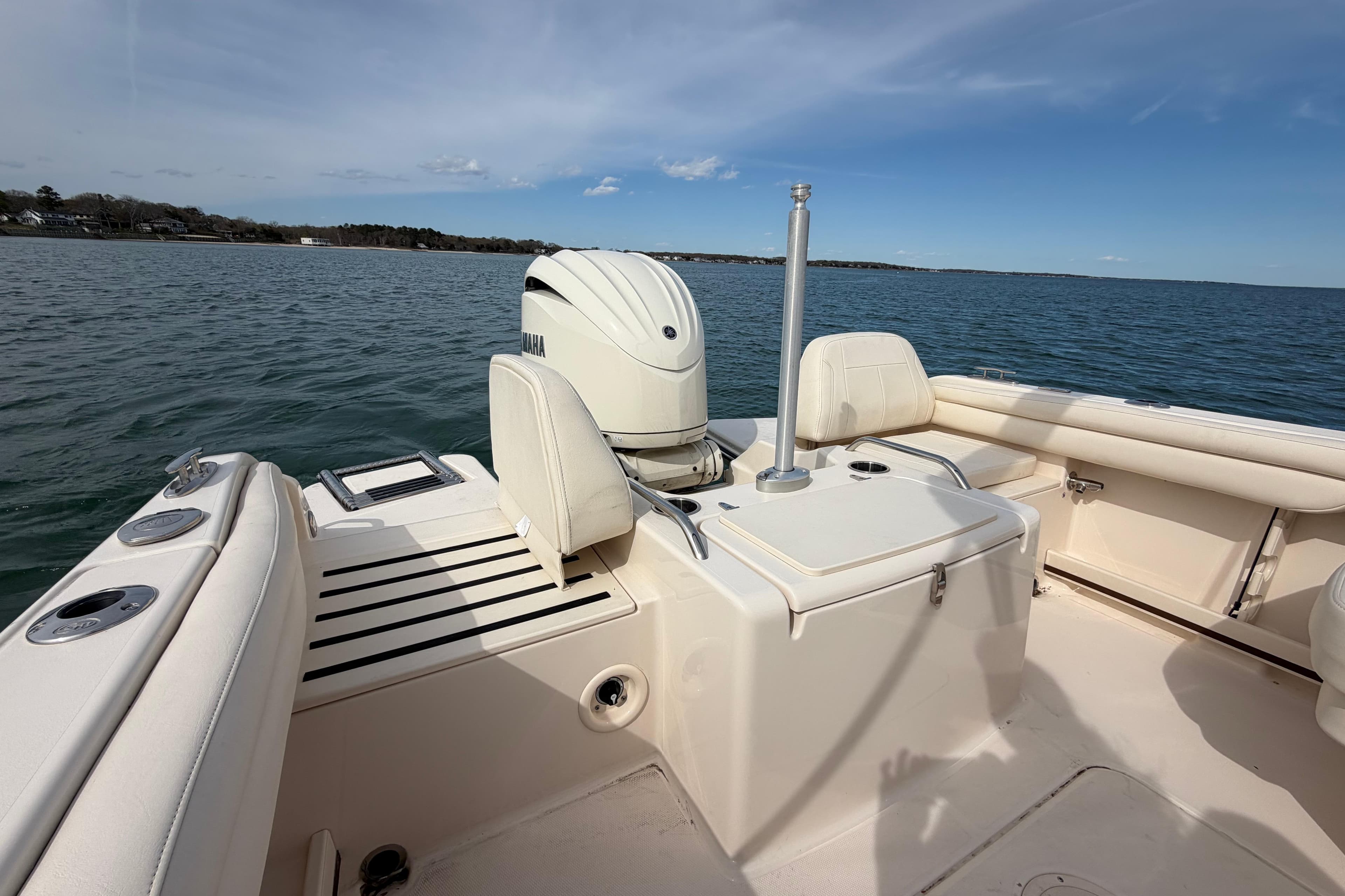 2025 Grady-White Freedom 215 boat on water, featuring Yamaha outboard motor.