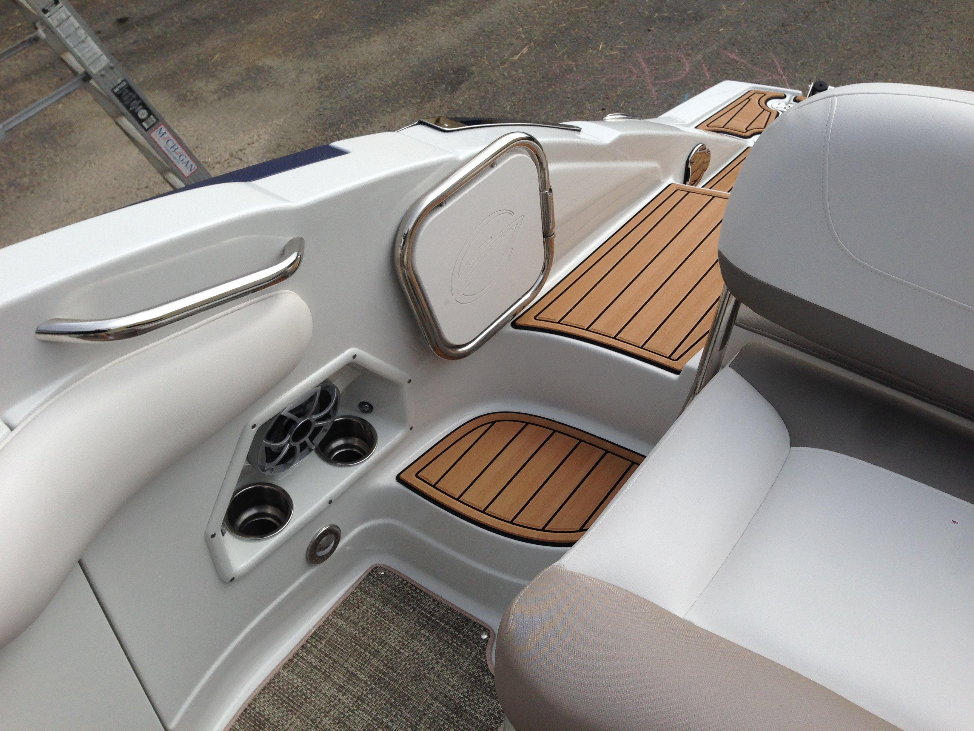 Interior of a 2016 Crownline 285 SS boat with wood accents.
