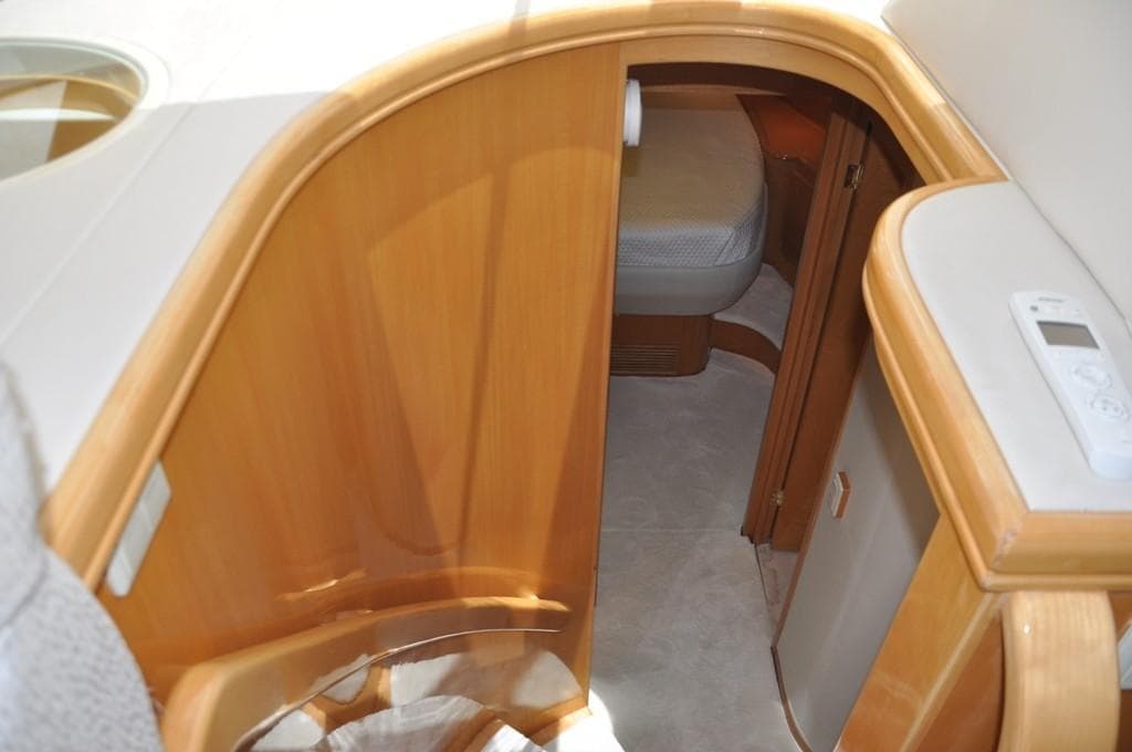 Interior cabin of a 2003 McKinna 58 yacht with wooden finishes.