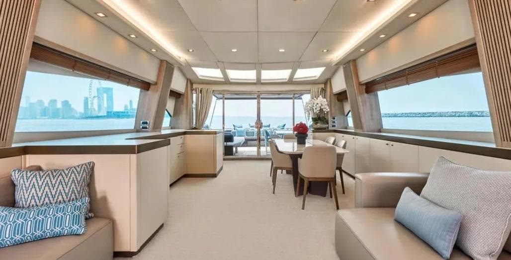 Luxurious interior of 2006 Sunseeker Predator 108 yacht with elegant seating and panoramic windows.