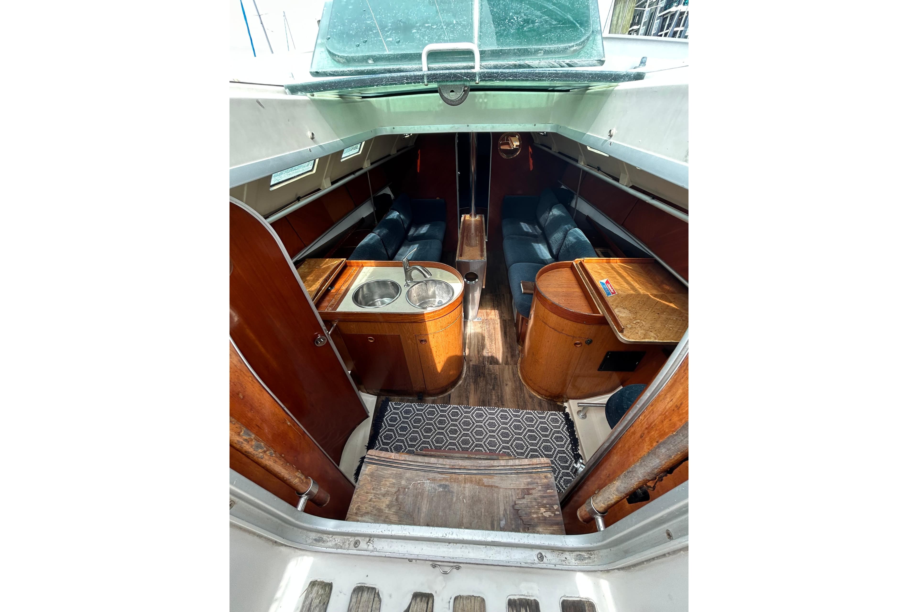 Interior of 1992 Beneteau First 35s5 sailboat with wood finishes and seating area.