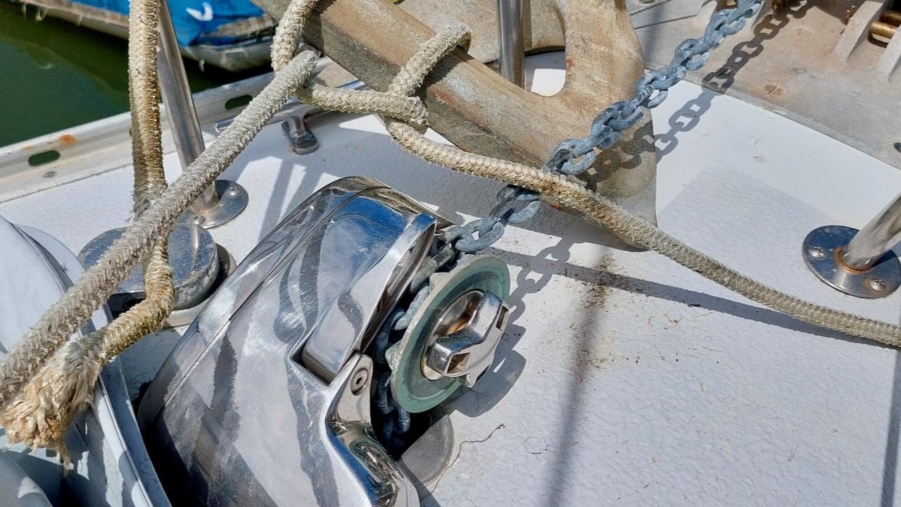 Anchor chain and winch on 1981 Morgan Out Island 41 sailboat deck.