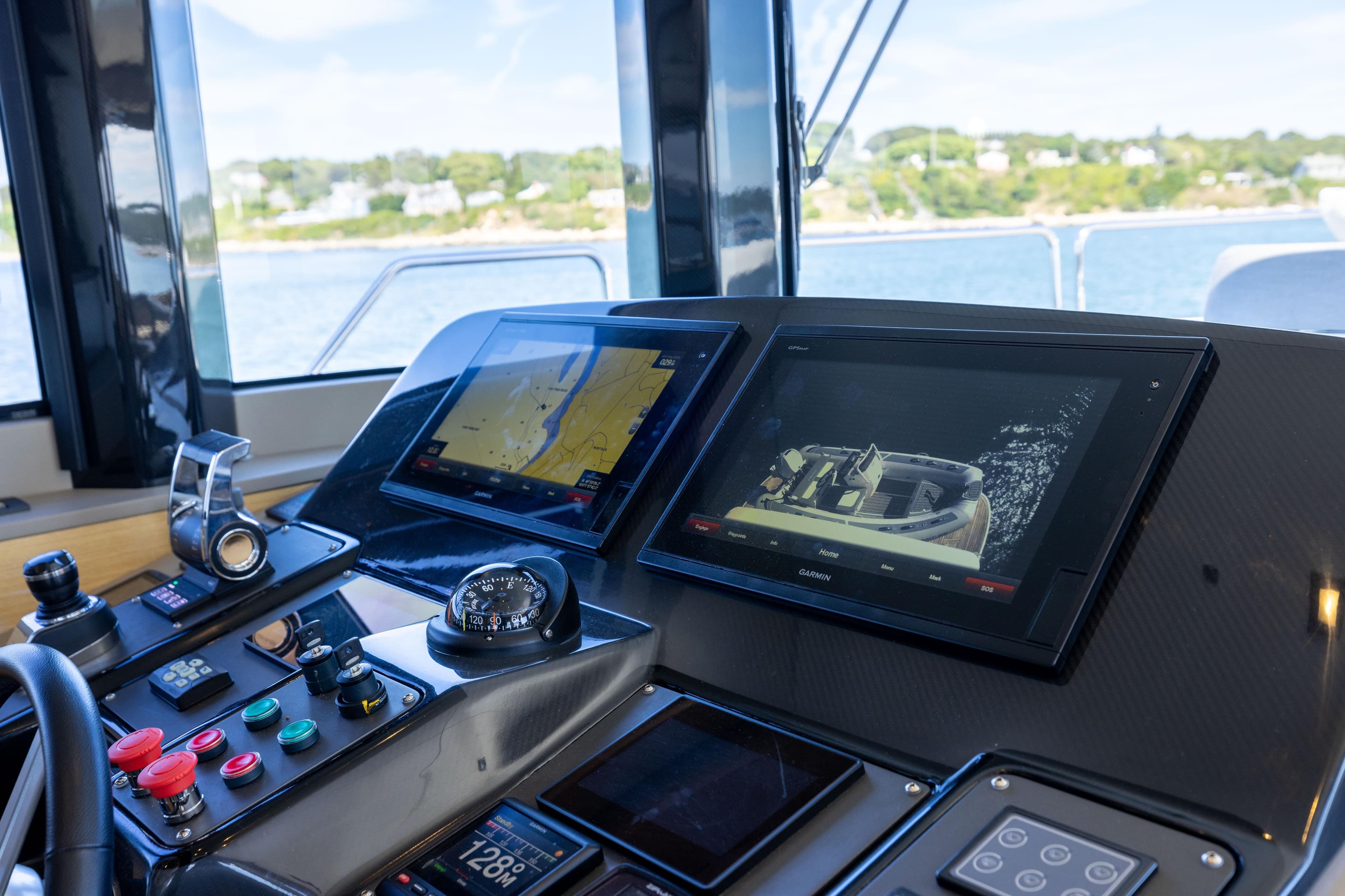 Cockpit of 2019 Sirena 64 yacht with navigation screens and controls.