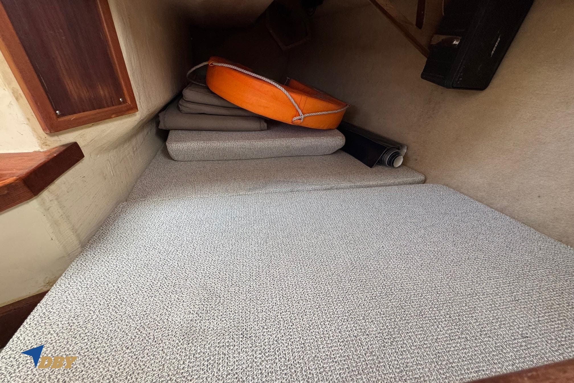 Interior cabin of a 1988 Phantom 33 boat with cushions and life preserver.