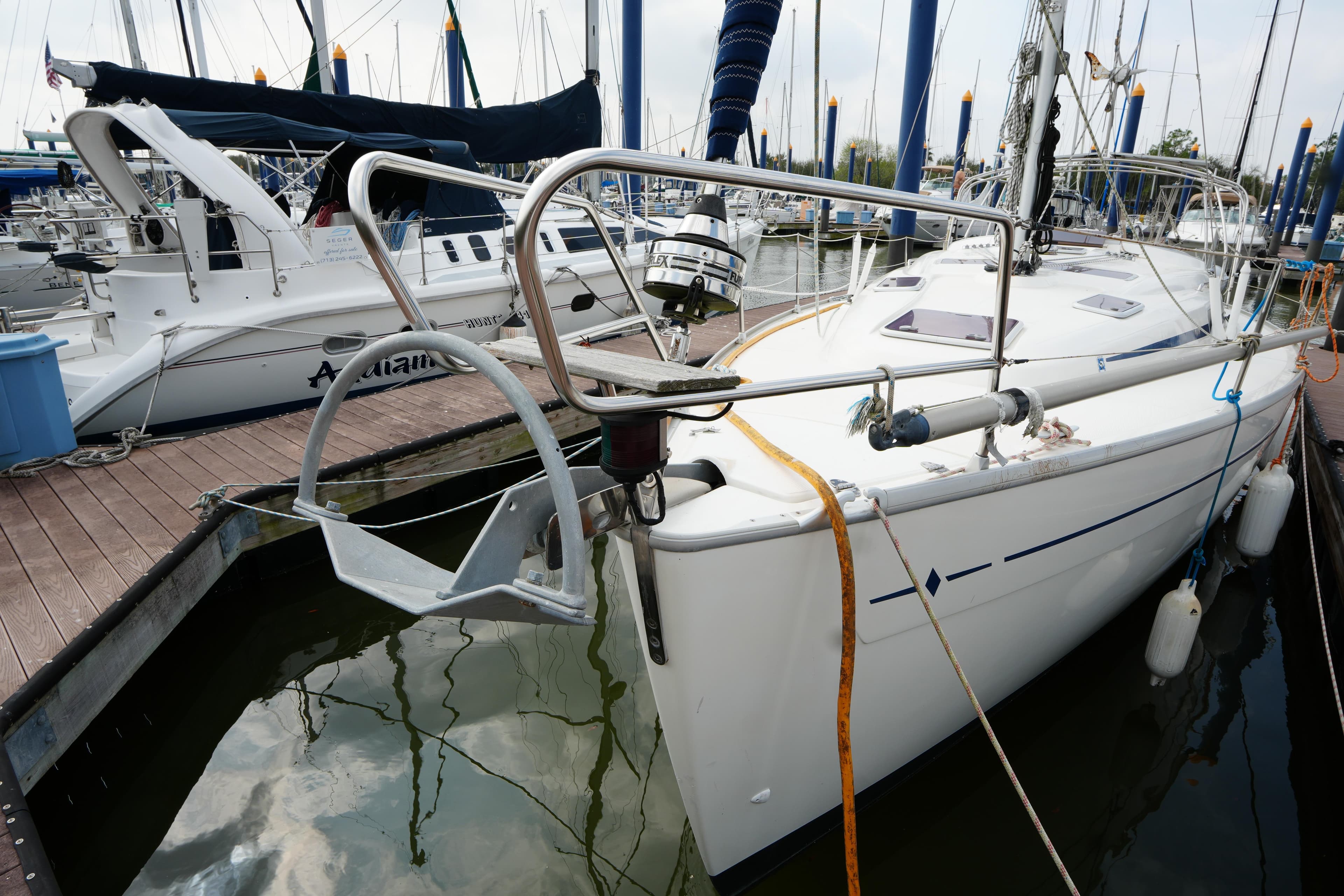 2007 Bavaria 37 C sailboat docked in a marina, surrounded by other boats.