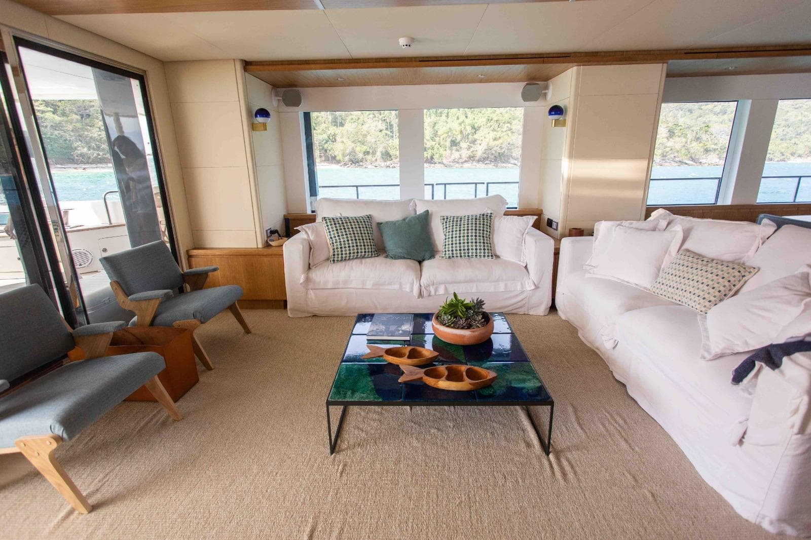 Luxurious interior of 2027 Inace Explora 90 yacht with elegant seating and scenic views.