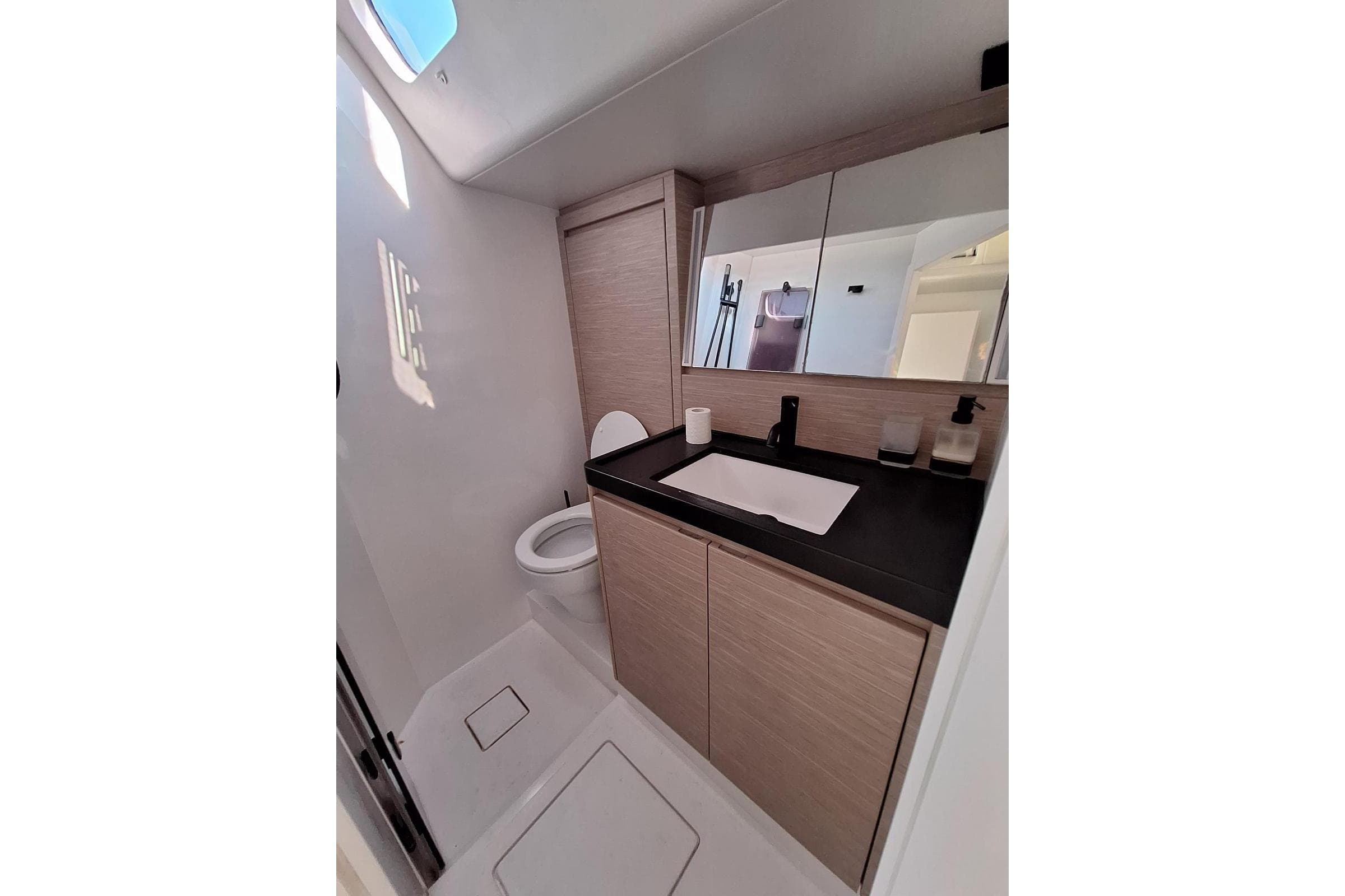 Modern bathroom interior on 2019 Ice Yachts 60, featuring sleek design and ample storage.