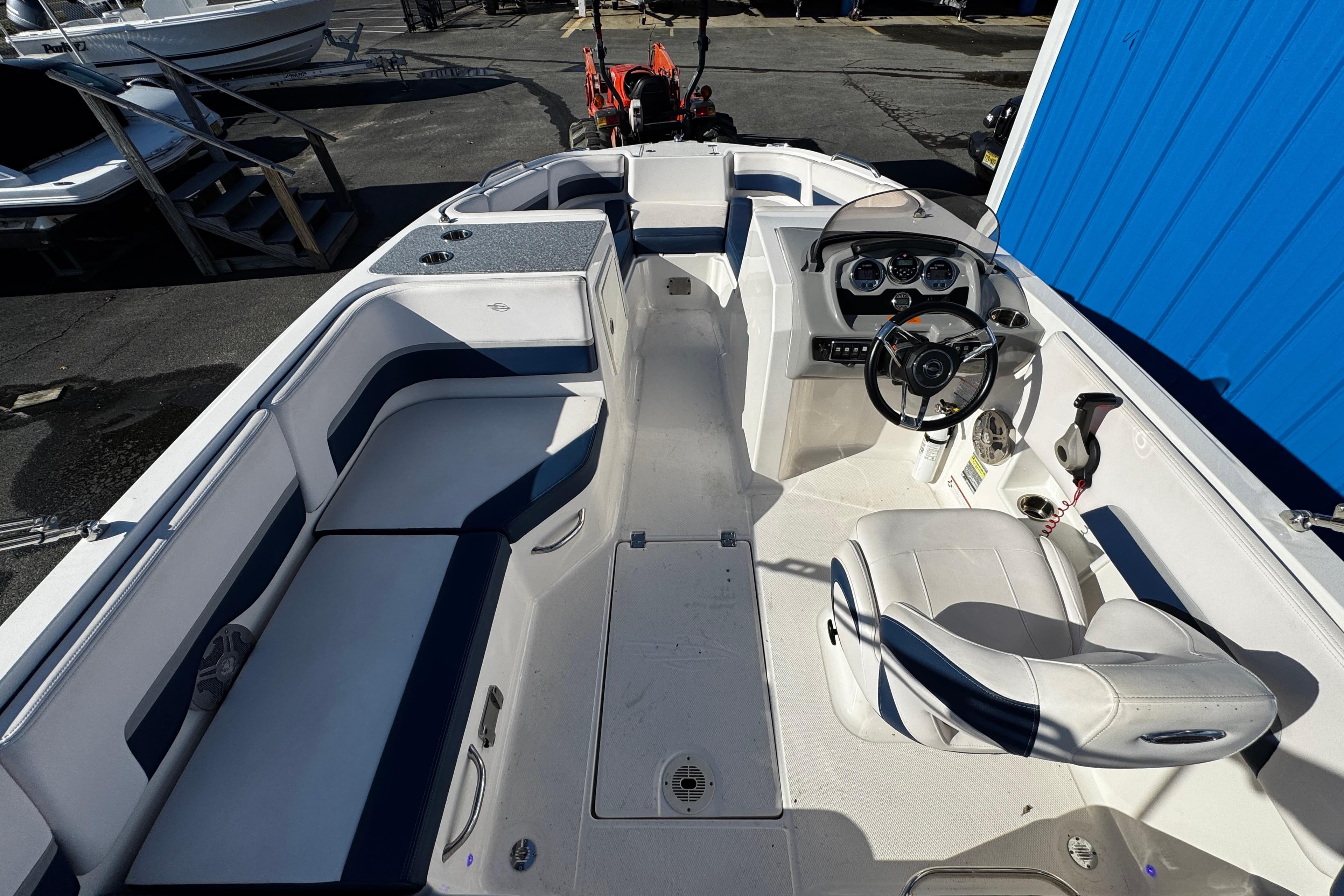 2019 Chaparral 191 Suncoast boat interior with seating and steering console.