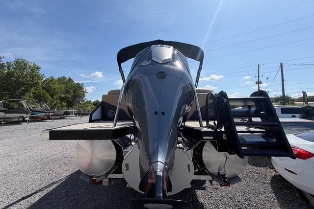 Evotti 523CS 2026 model boat, sleek design, parked outdoors under clear blue sky.