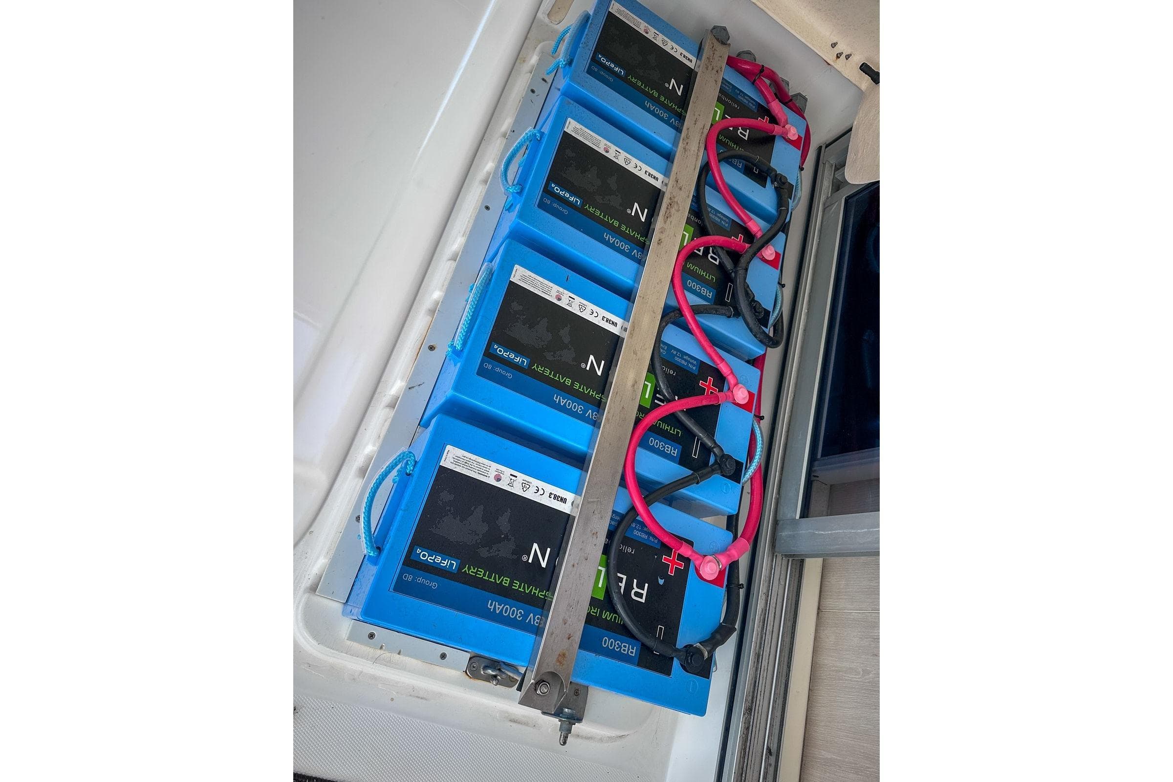 Battery compartment of a 2016 Leopard 48 yacht with multiple blue lithium batteries.