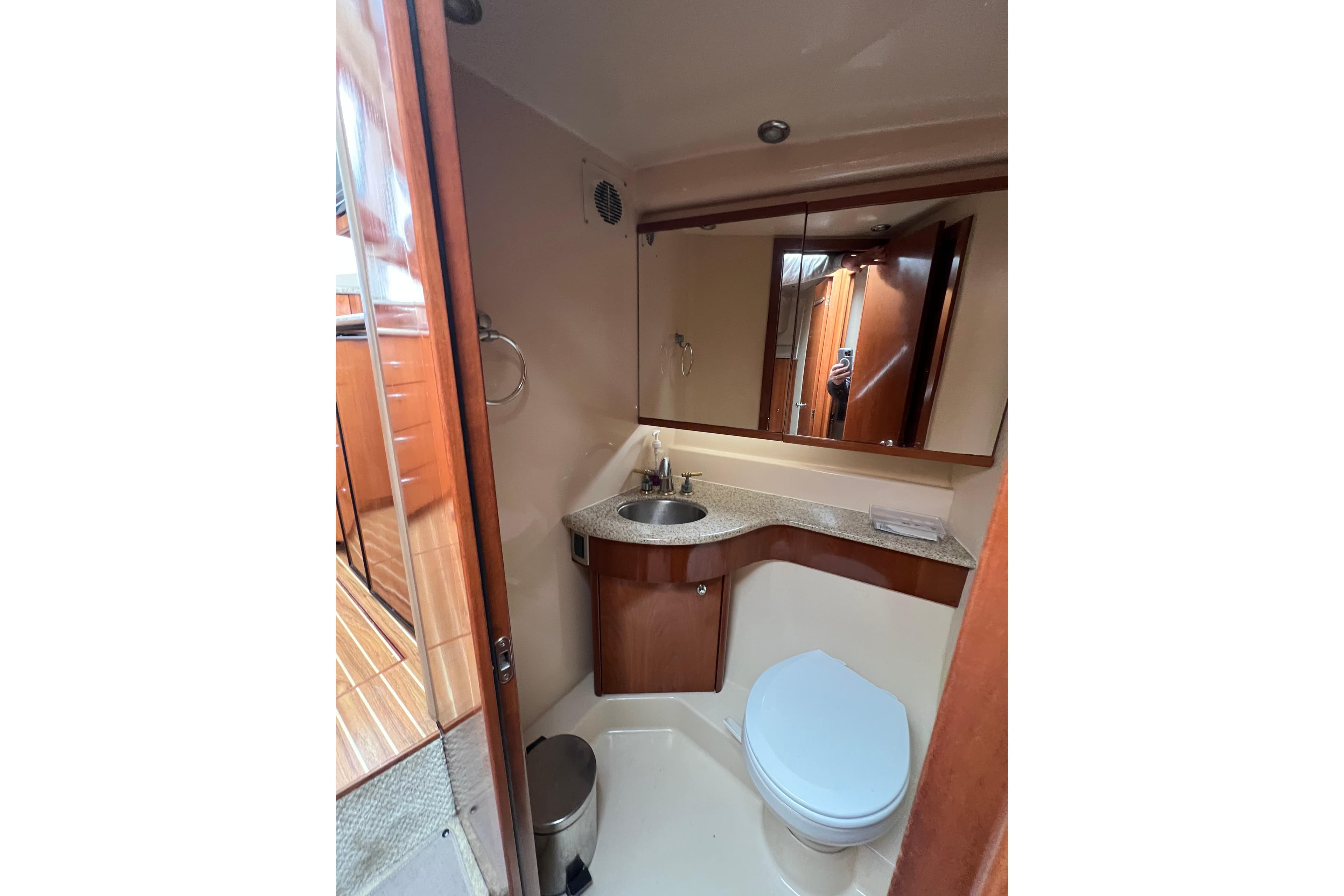 Luxurious bathroom in 2007 Meridian 391 Sedan yacht with modern fixtures and elegant design.