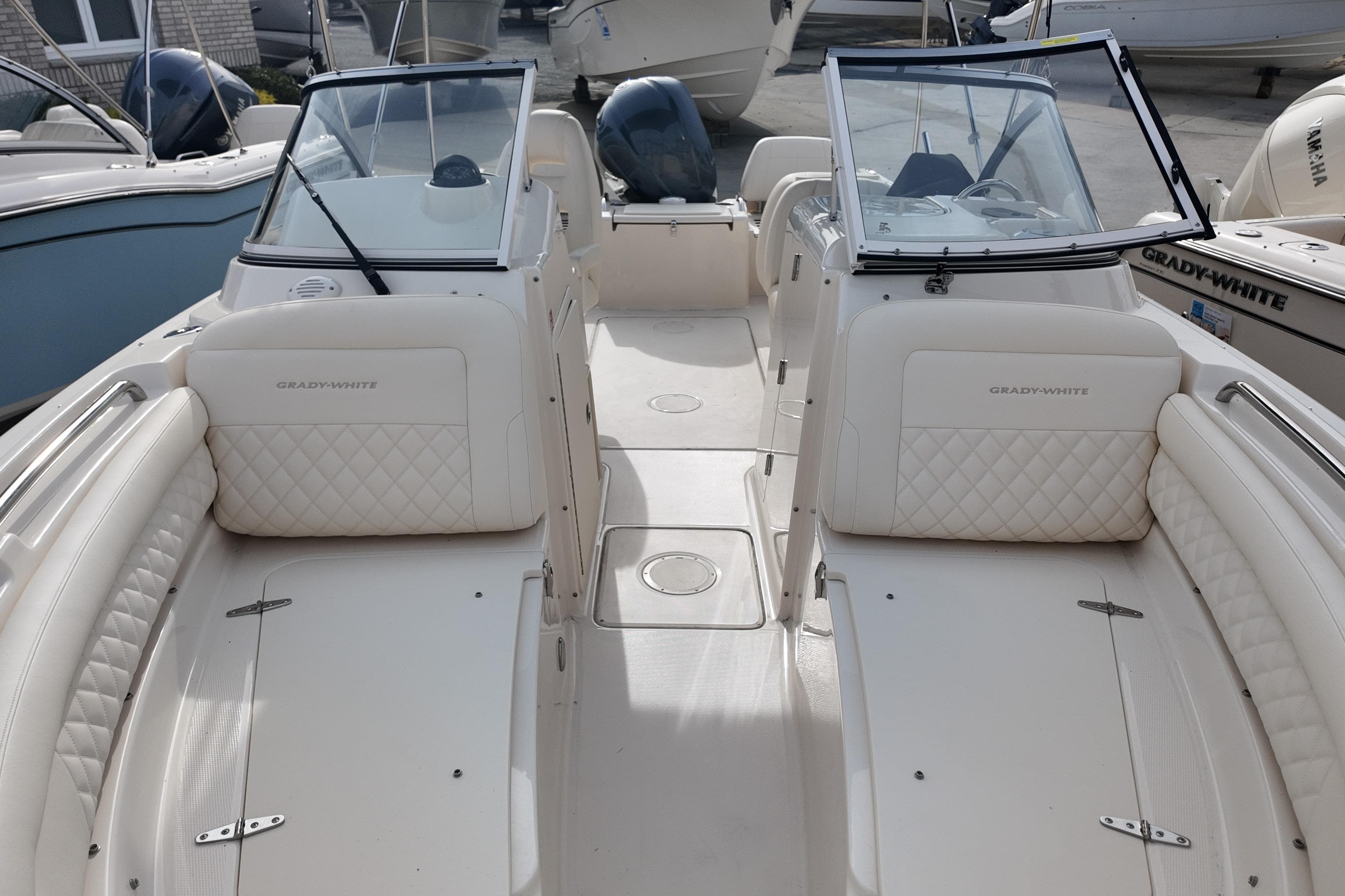 2026 Grady-White Freedom 215 boat interior with dual consoles and cushioned seating.