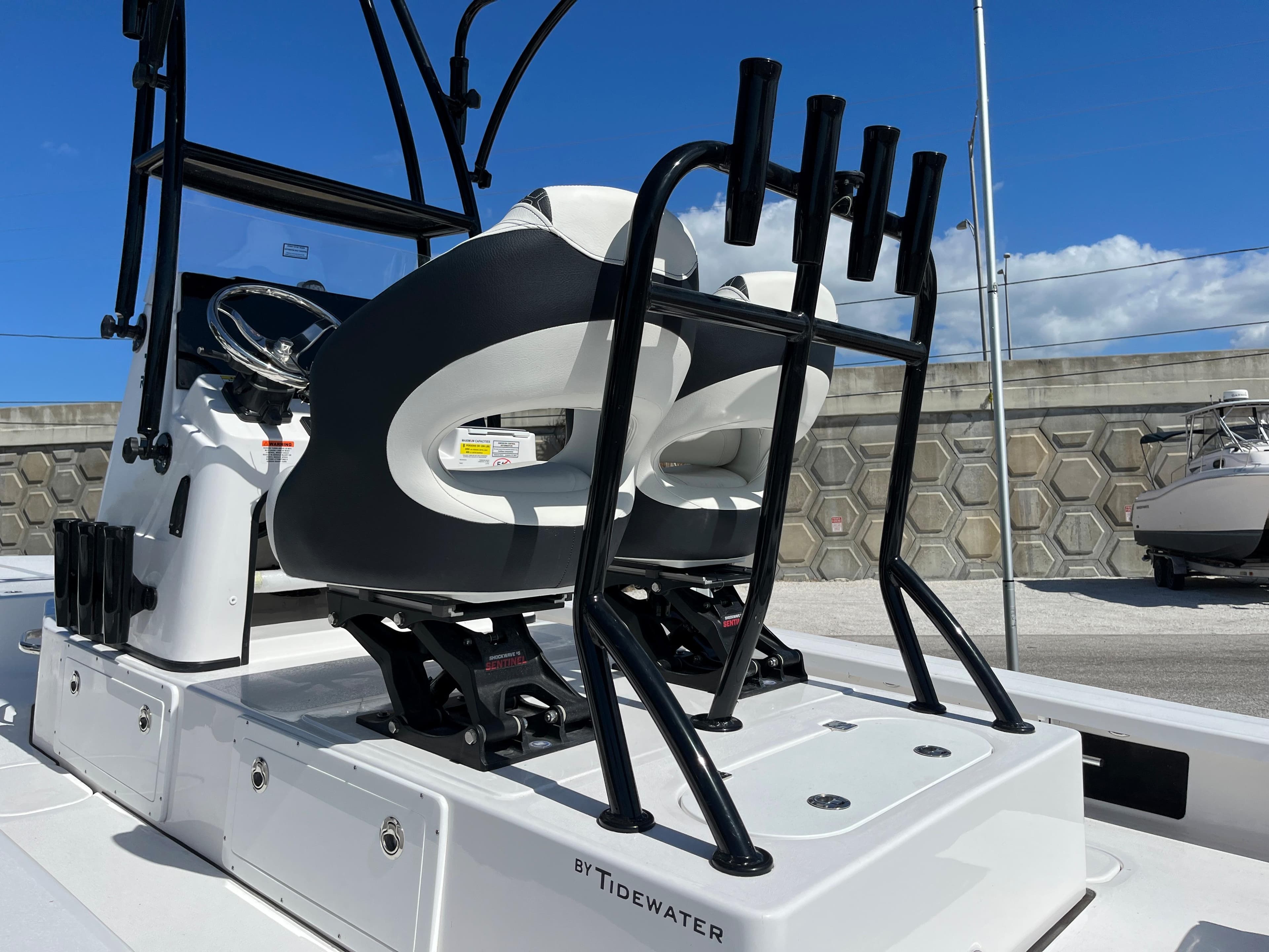 2025 Tidewater 25 TPC boat with dual seats and rod holders.